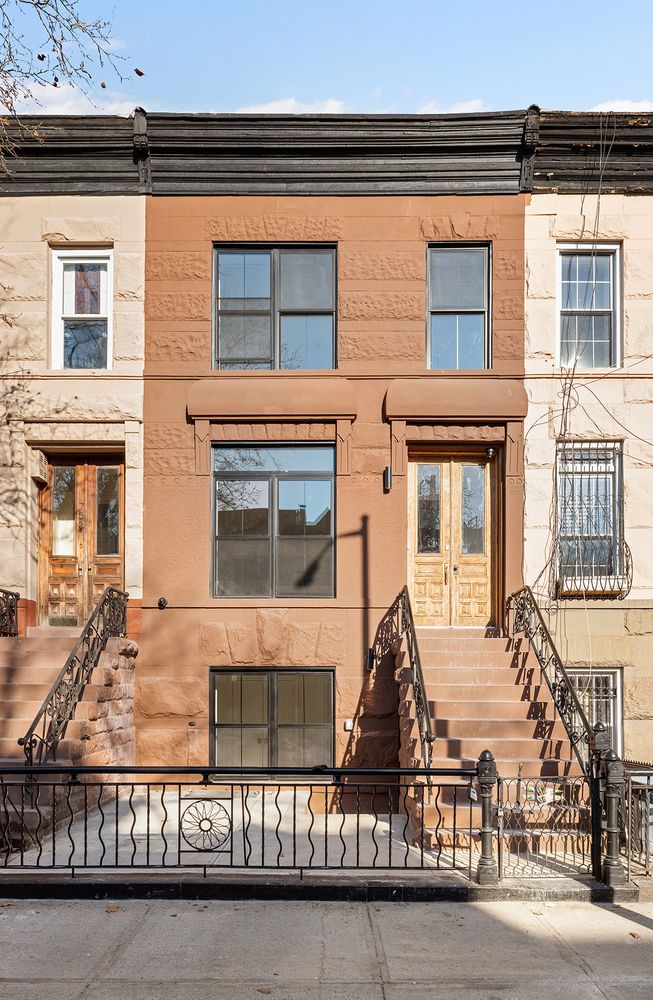 a view of a brick building with many windows