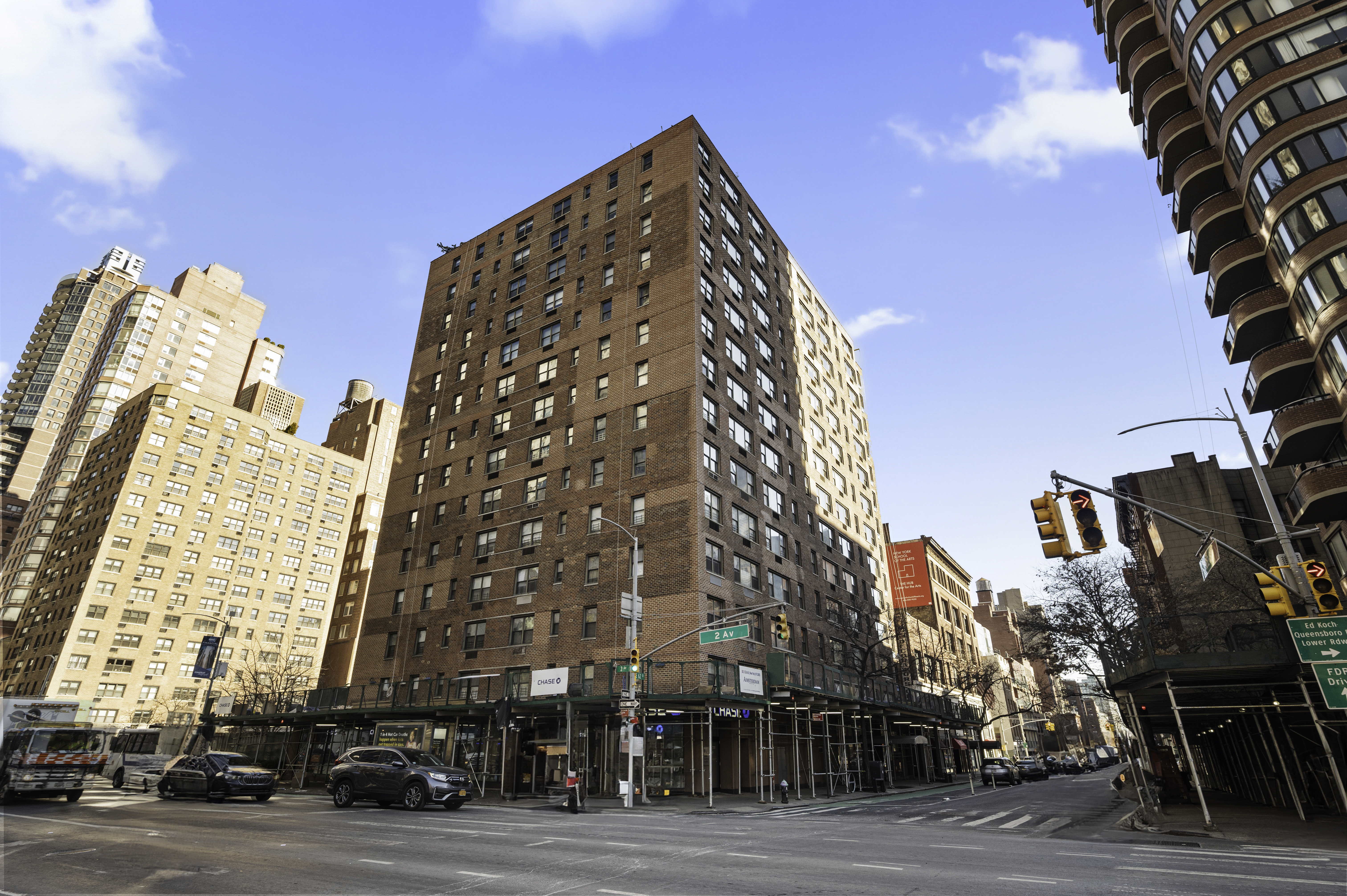 301 East 62nd Street, Unit 7K Manhattan, NY 10065 - Photo 13 of 14 a view of a tall building next to a road