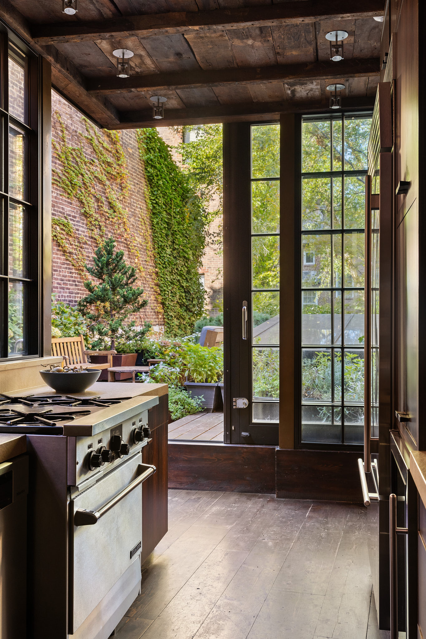 13 Vandam Street Manhattan, NY 10014 - Photo 9 of 26 a kitchen with a stove and a large window