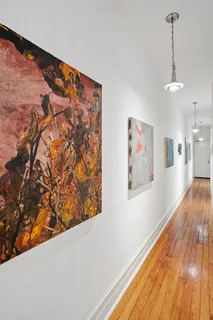 a view of a hallway with a wooden floor