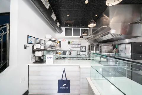 a kitchen with stainless steel appliances granite countertop a sink and cabinets