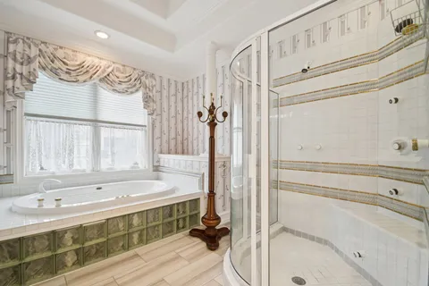 a bathroom with a bathtub and a shower