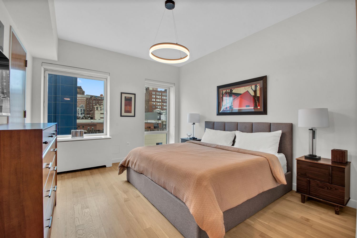454 West 54th Street, Unit PHC Manhattan, NY 10019 - Photo 11 of 27 a bedroom with a bed and a window
