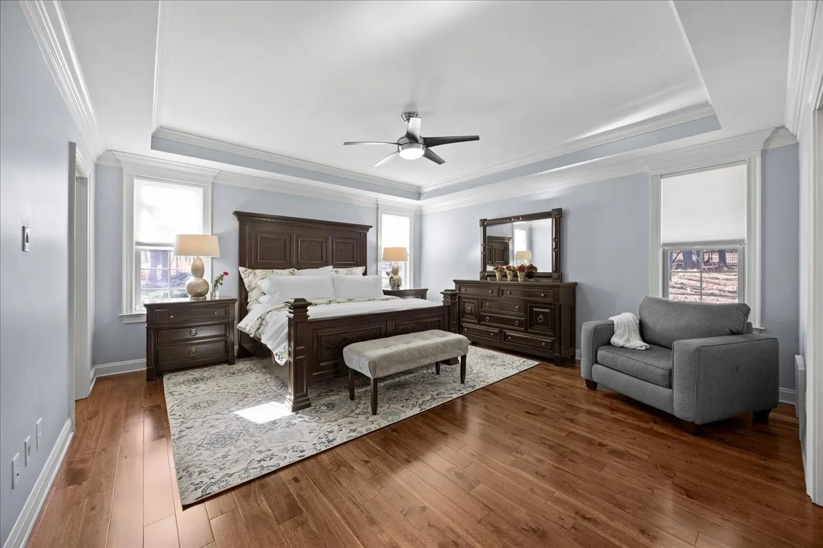a living room with furniture and a book shelf