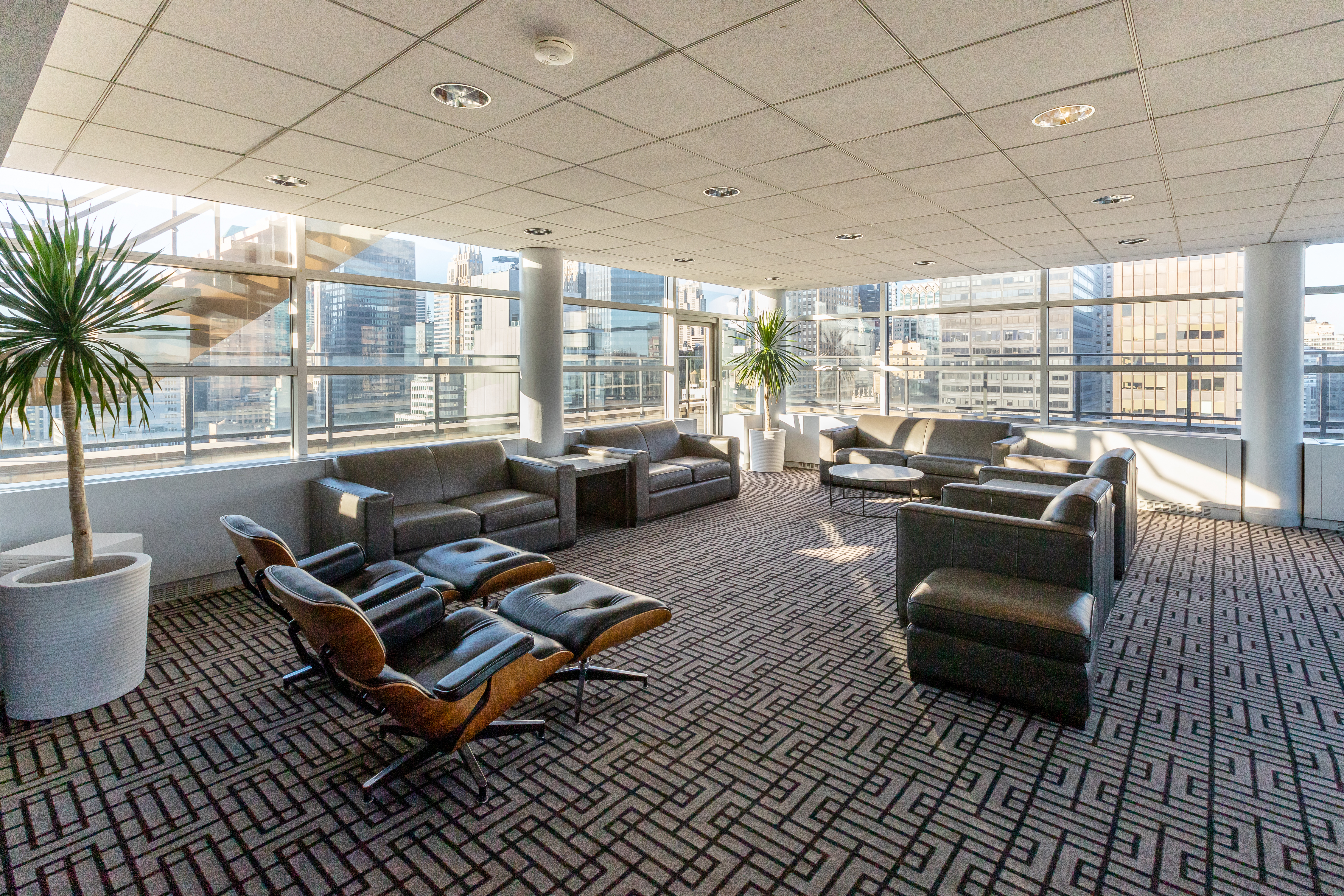 160 East 38th Street, Unit 32A Manhattan, NY 10016 - Photo 19 of 22 a living room with furniture floor to ceiling window and a table