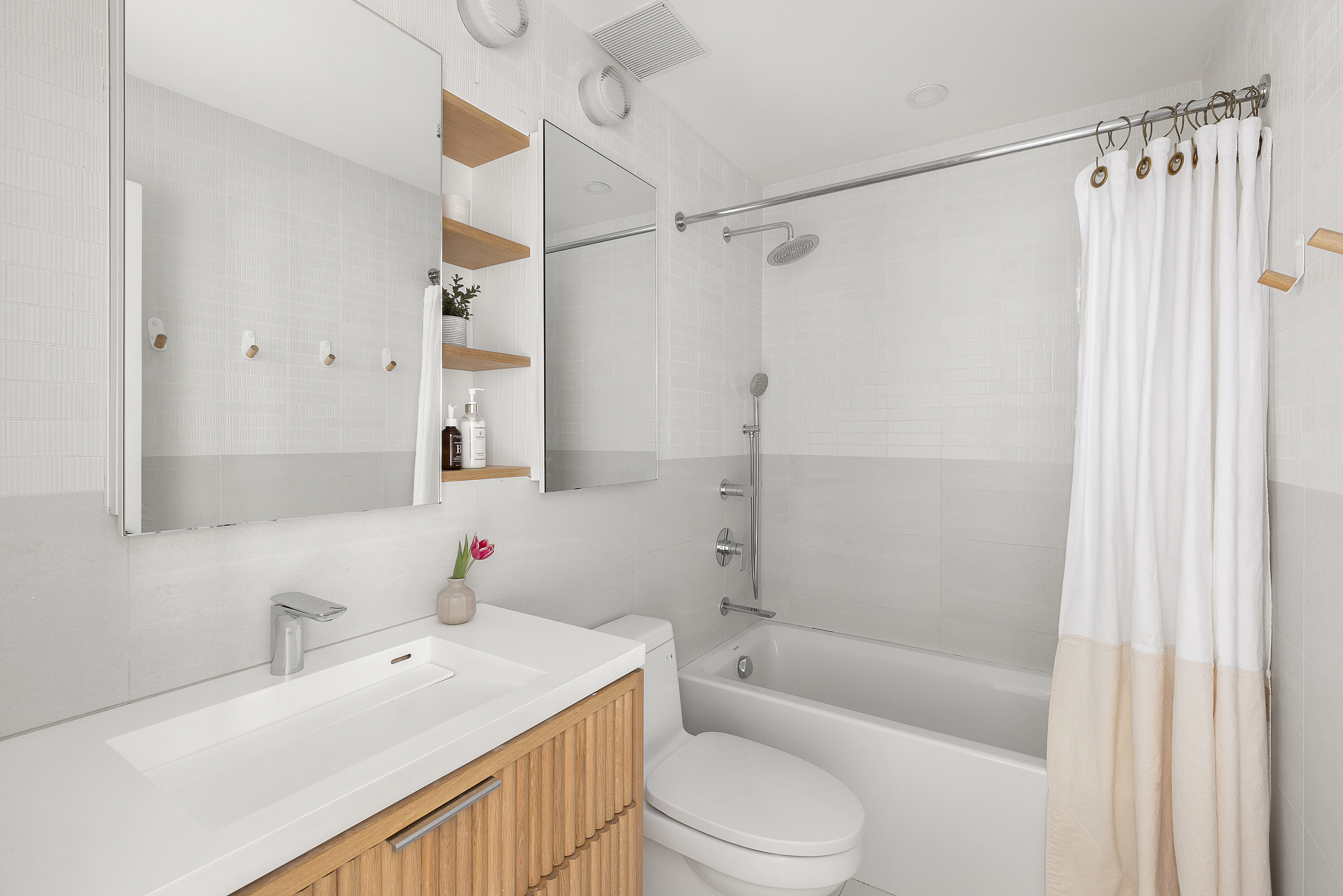 420 12th Street, Unit E1L Brooklyn, NY 11215 - Photo 12 of 15 a bathroom with a sink toilet tub and shower