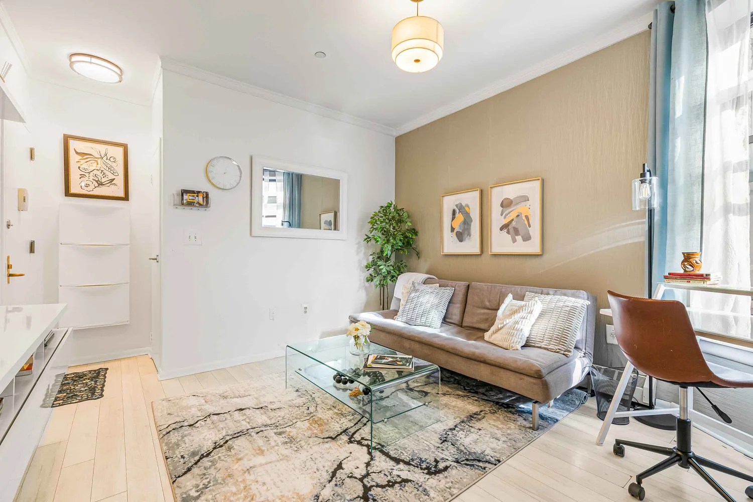 a living room with a couch and a rug
