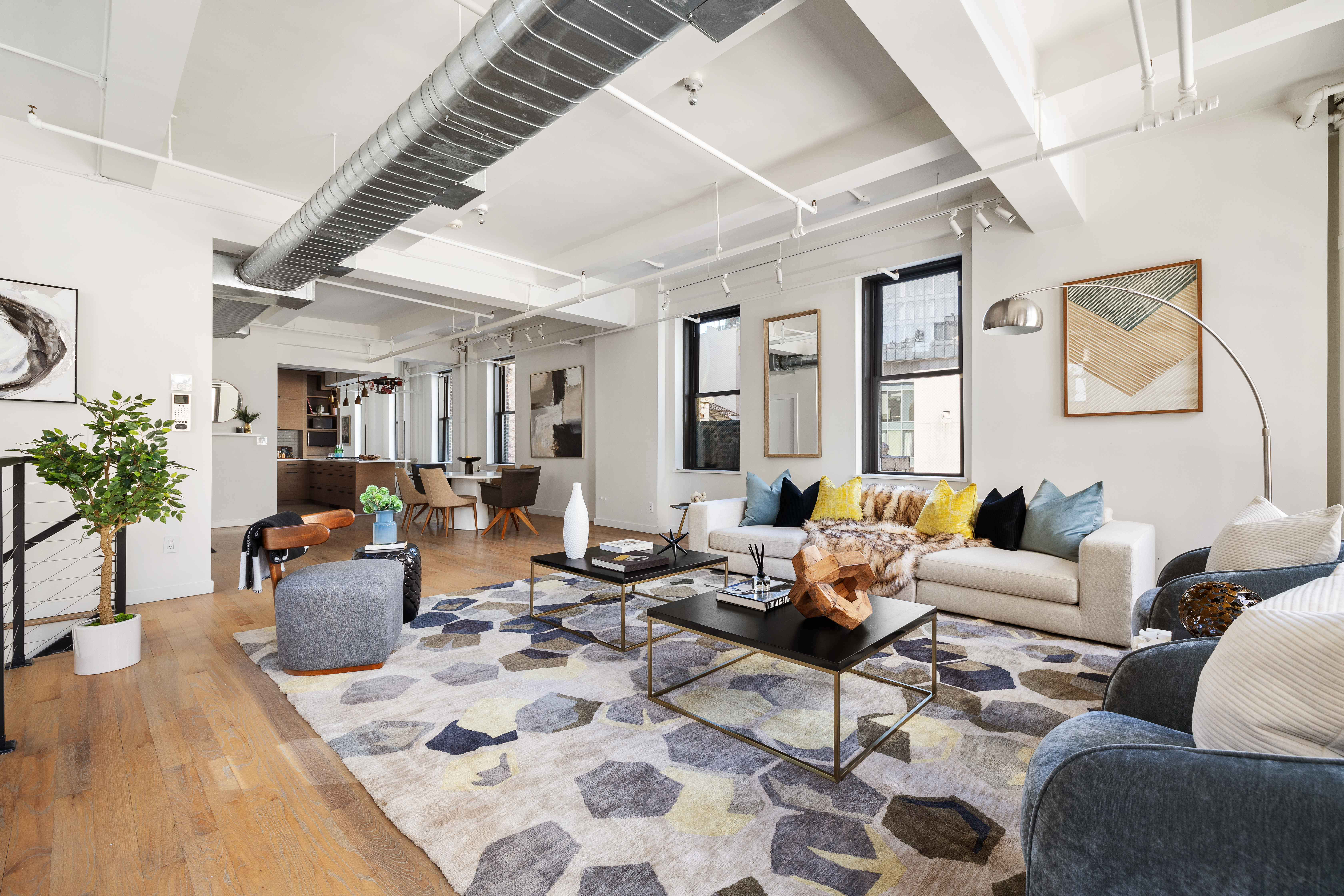 24 West 30th Street, Unit 6 Manhattan, NY 10001 - Photo 3 of 14 a living room with furniture and wooden floor