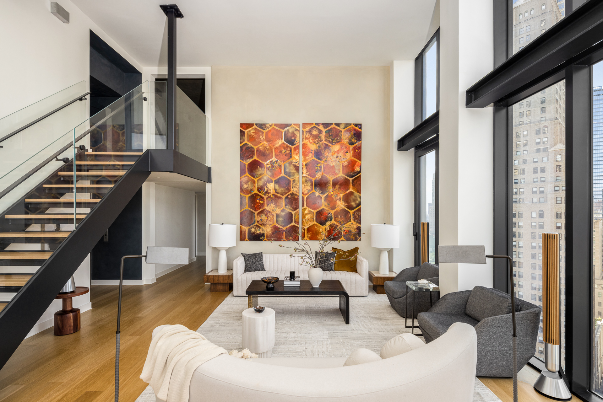 33 Park Row, Unit PH1 Manhattan, NY 10038 - Photo 5 of 15 a living room with furniture and a large window