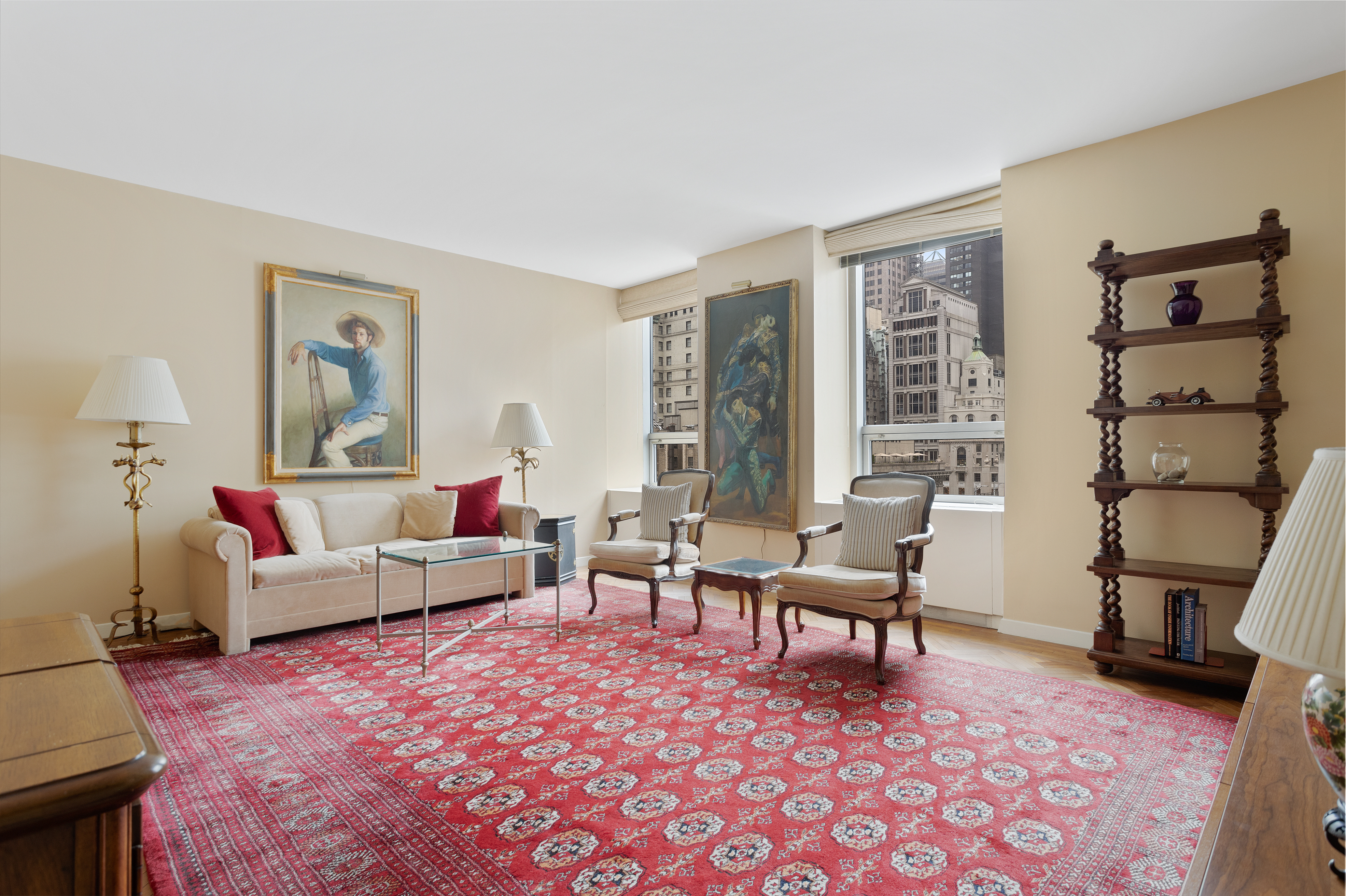 15 West 53rd Street, Unit 11H Manhattan, NY 10019 - Photo 2 of 11 a living room with furniture and a window