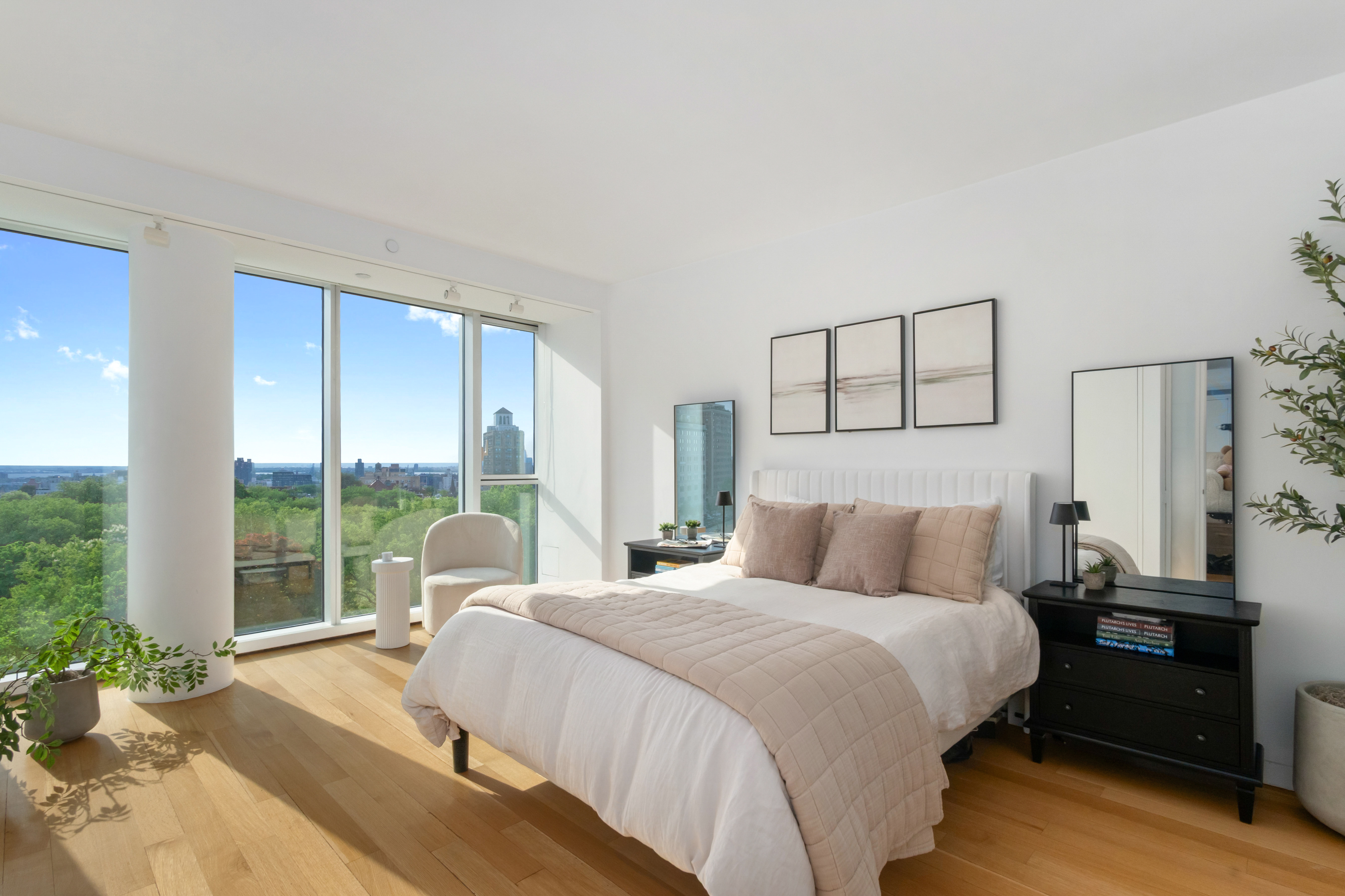 1 Grand Army Plaza, Unit 9D Brooklyn, NY 11238 - Photo 7 of 20 a bedroom with a bed and wooden floor