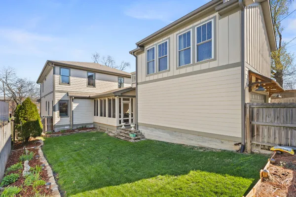 a view of house with a yard