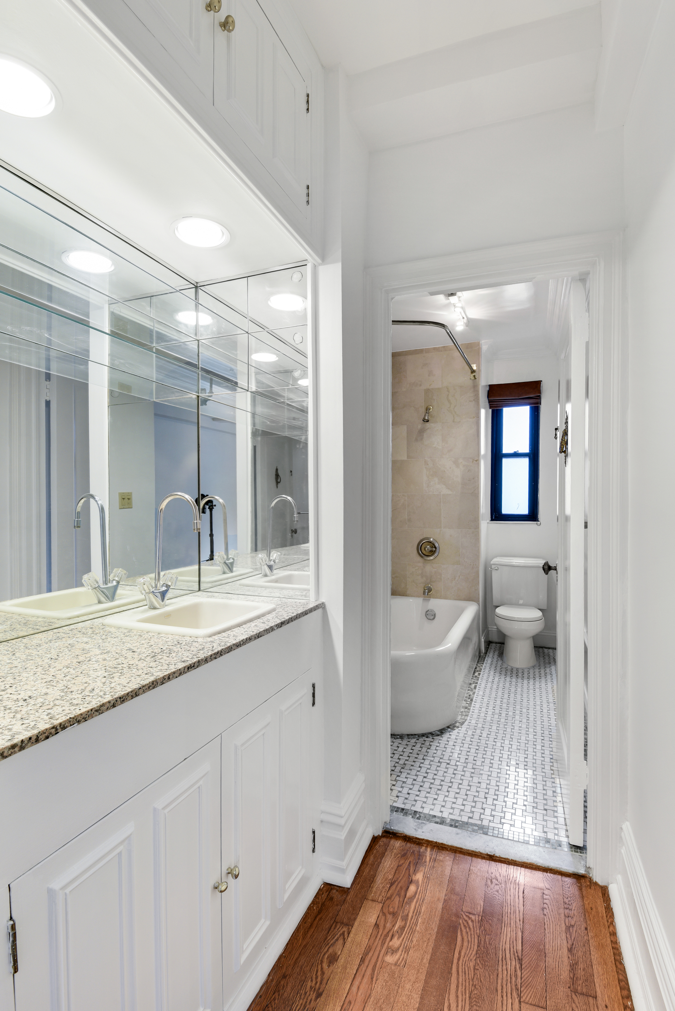 7 Park Avenue, Unit 8A9ABC Manhattan, NY 10016 - Photo 8 of 23 a en suite bathroom with a granite countertop tub sink and mirror