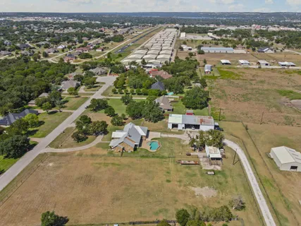 an aerial view of residential houses with outdoor space