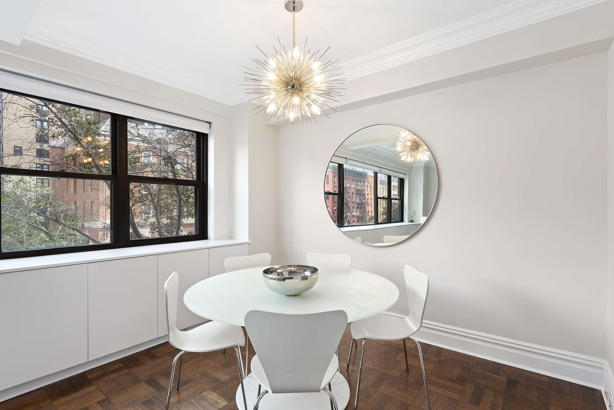 165 East 72nd Street, Unit 3L Manhattan, NY 10021 - Photo 2 of 13 a dining room with furniture and window