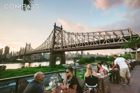 a front view of a house with garden and patio