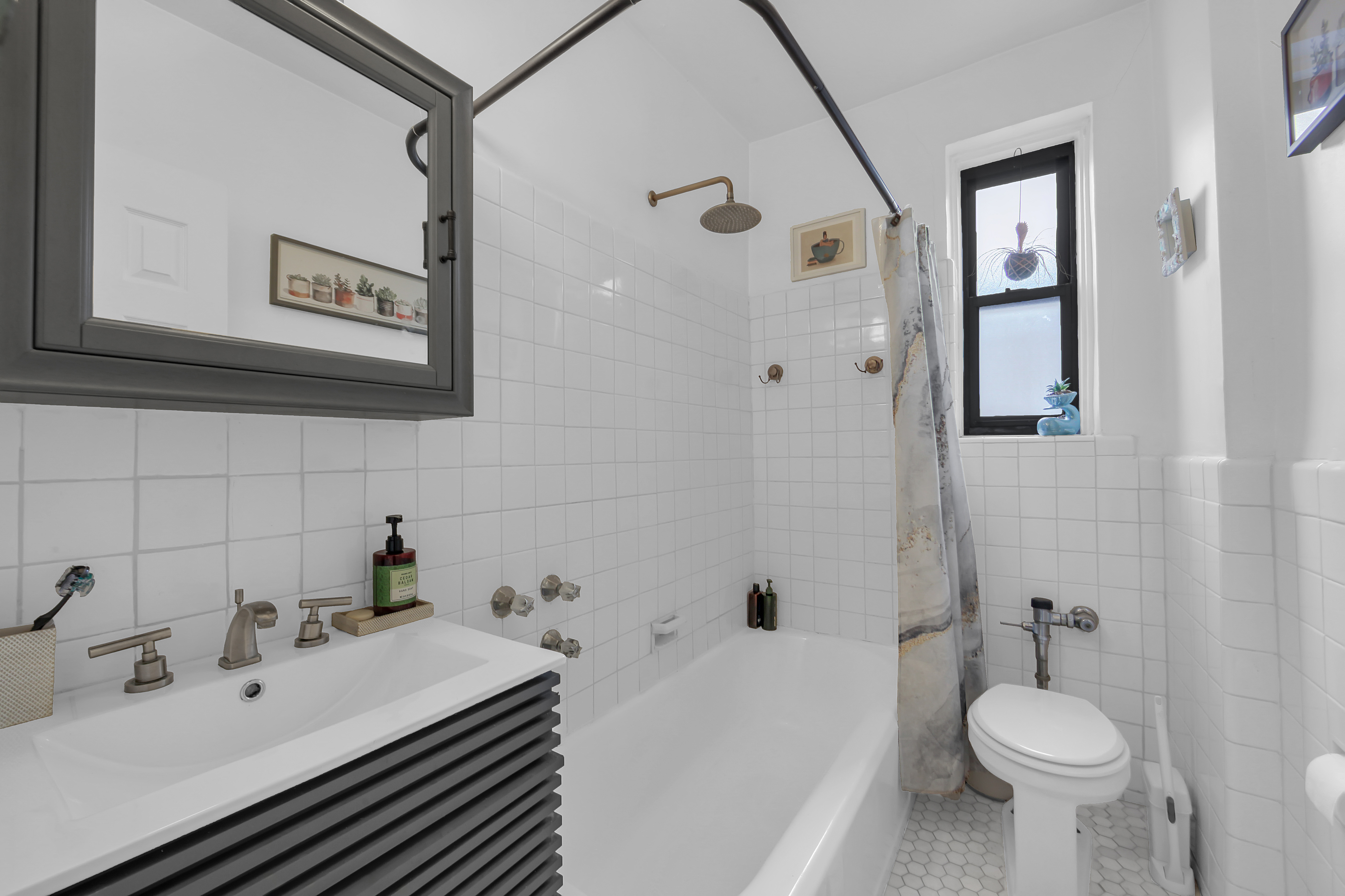 55 East 190th Street, Unit 59 Bronx, NY 10468 - Photo 10 of 14 a bathroom with a sink toilet and shower