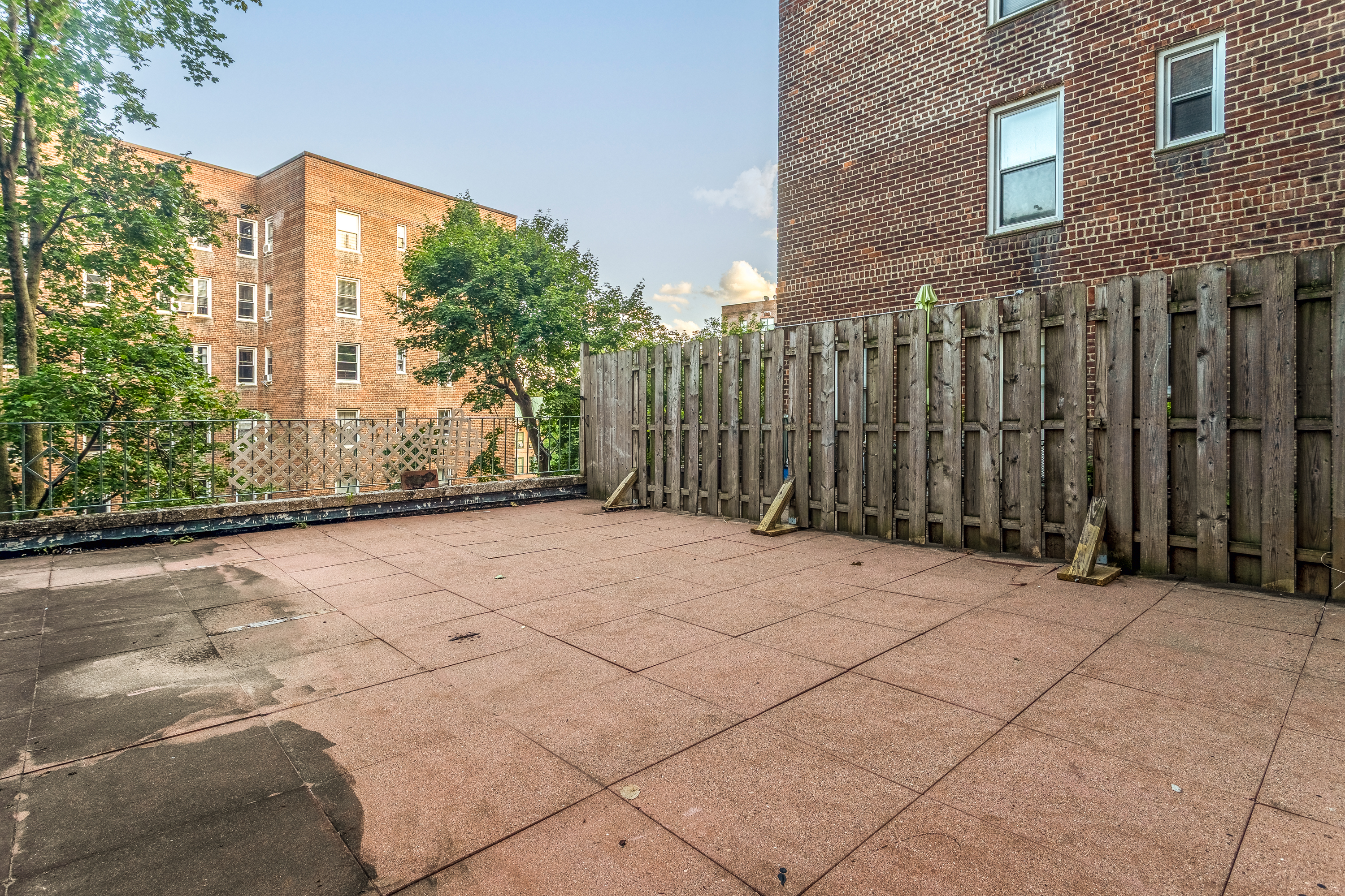 5610 Netherland Avenue, Unit 1G Bronx, NY 10471 - Photo 12 of 14 a view of a building with backyard