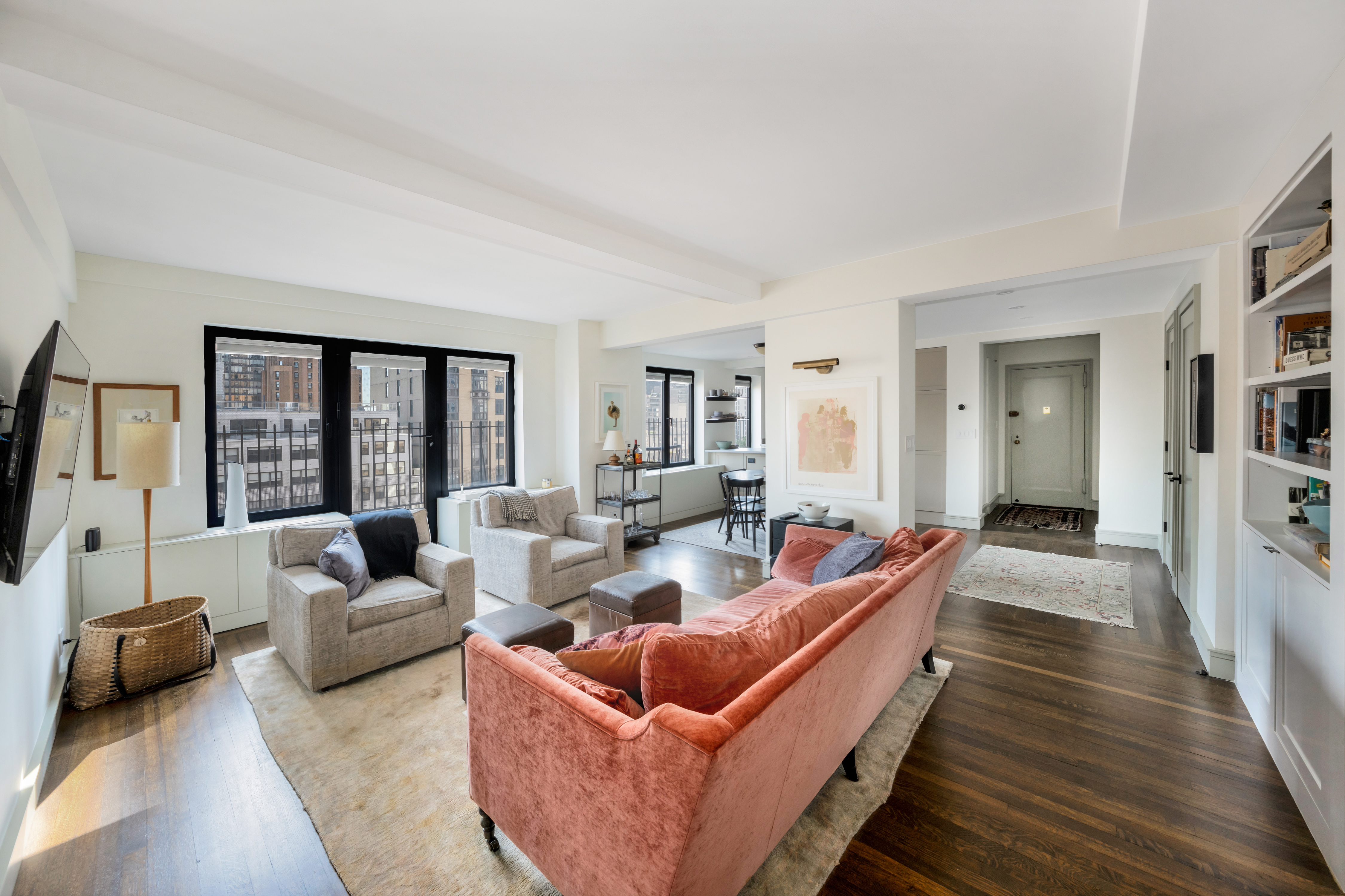 400 East 52nd Street, Unit 14J Manhattan, NY 10022 - Photo 1 of 11 a living room with furniture and a large window