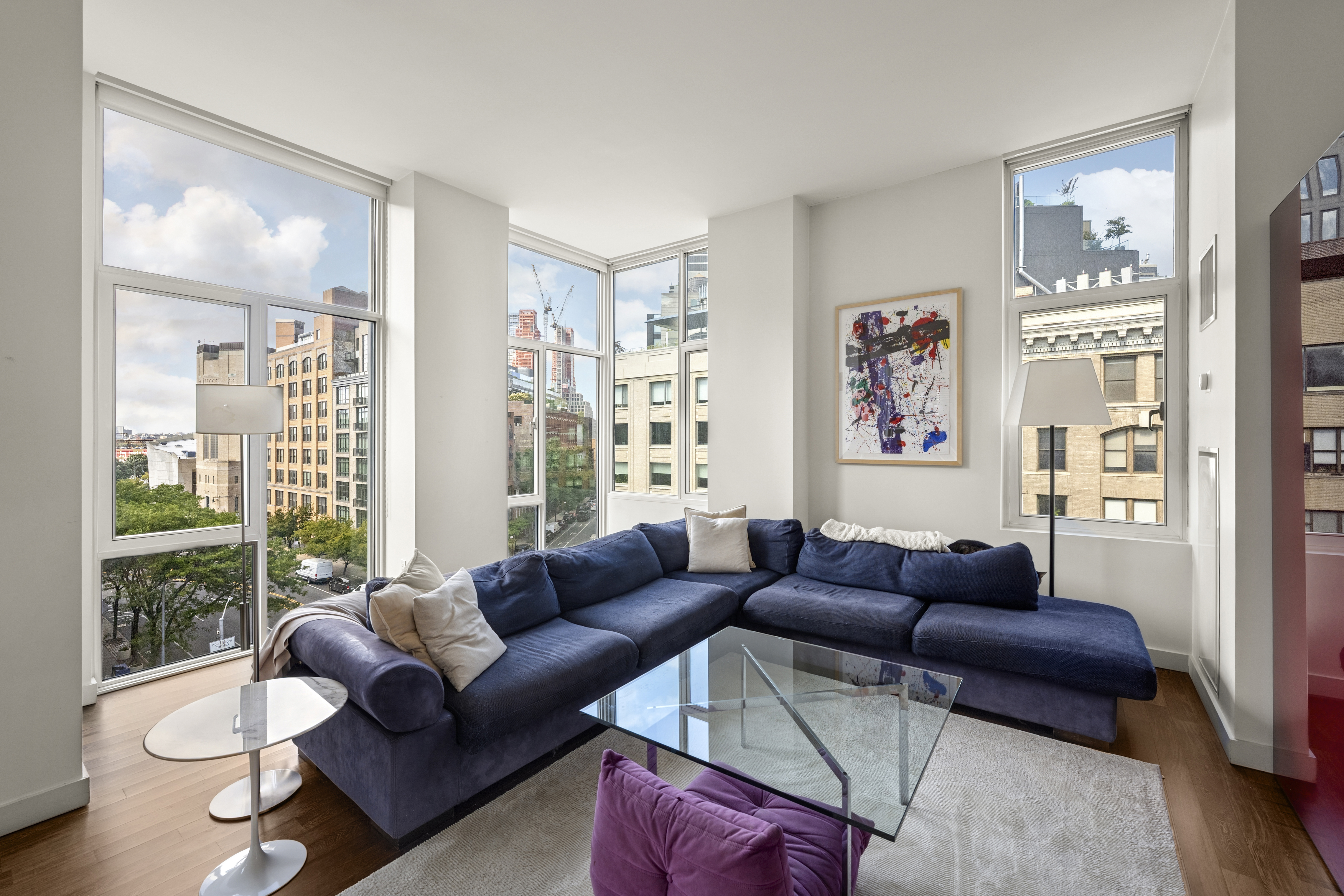475 Greenwich Street, Unit 5B Manhattan, NY 10013 - Photo 5 of 16 a living room with furniture and a large window