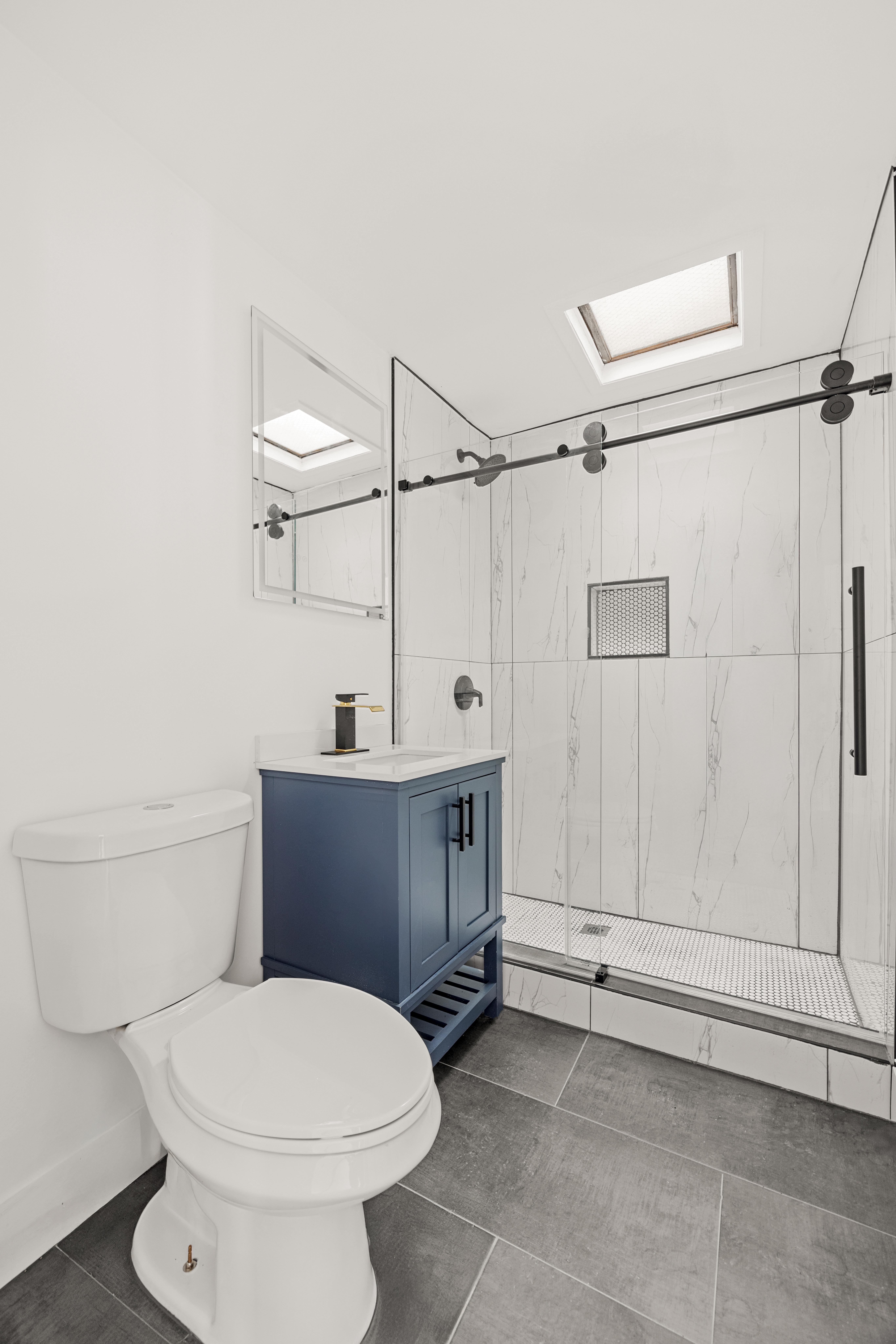 126 Quincy Street, Unit 3 Brooklyn, NY 11216 - Photo 9 of 11 a bathroom with a toilet a sink and shower