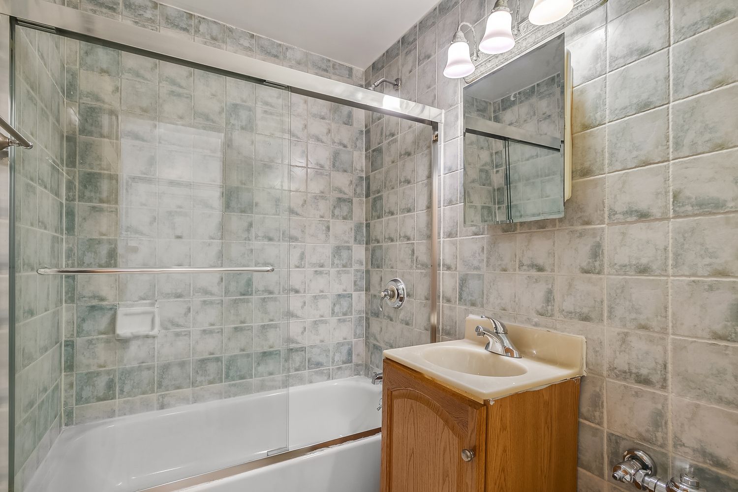 304 West 10th Street, Unit 4B Manhattan, NY 10014 - Photo 8 of 10 a bathroom with a sink shower and a bathtub