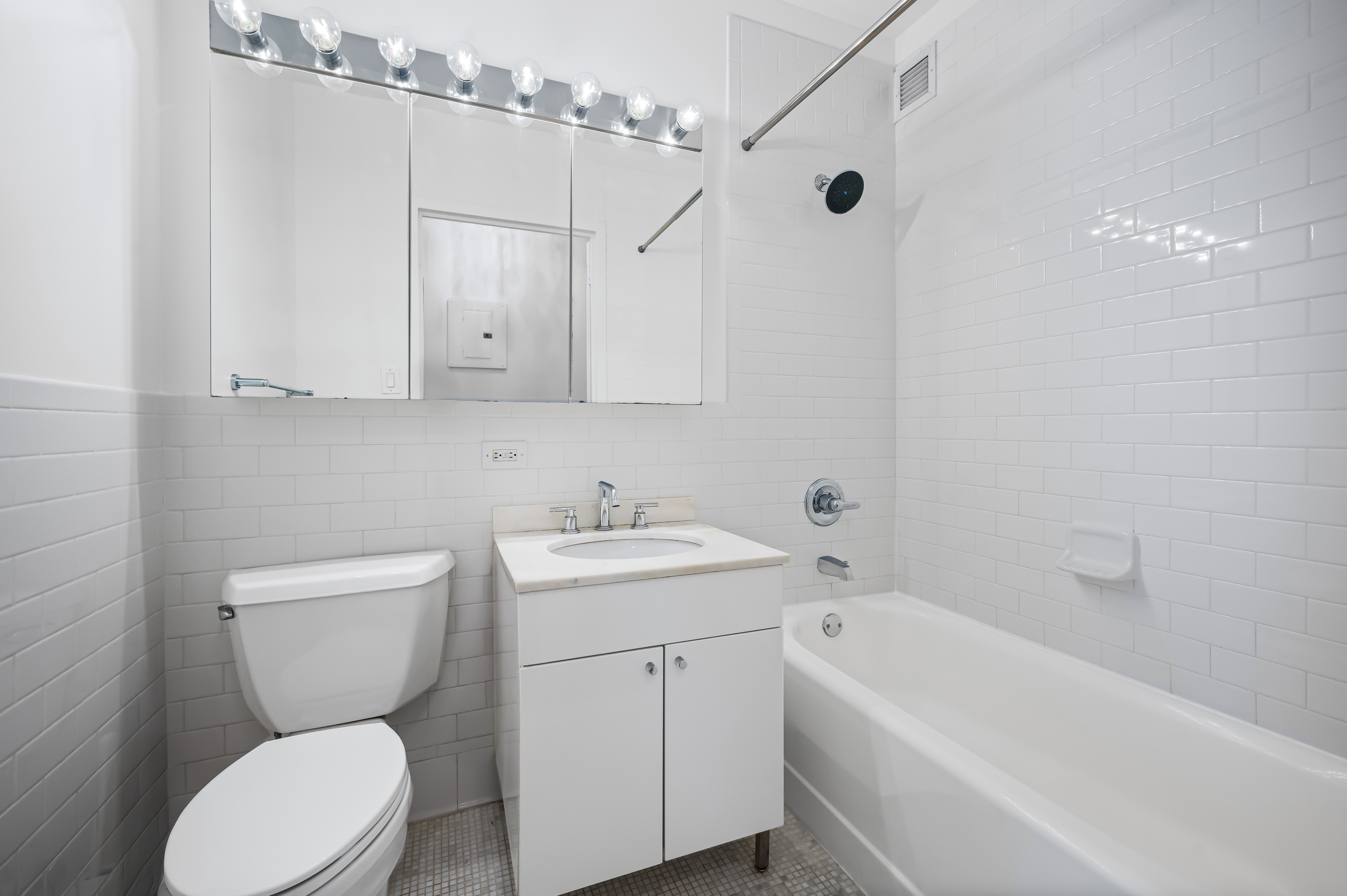 99 John Street, Unit 920 Manhattan, NY 10038 - Photo 5 of 18 a bathroom with a toilet a sink and bathtub