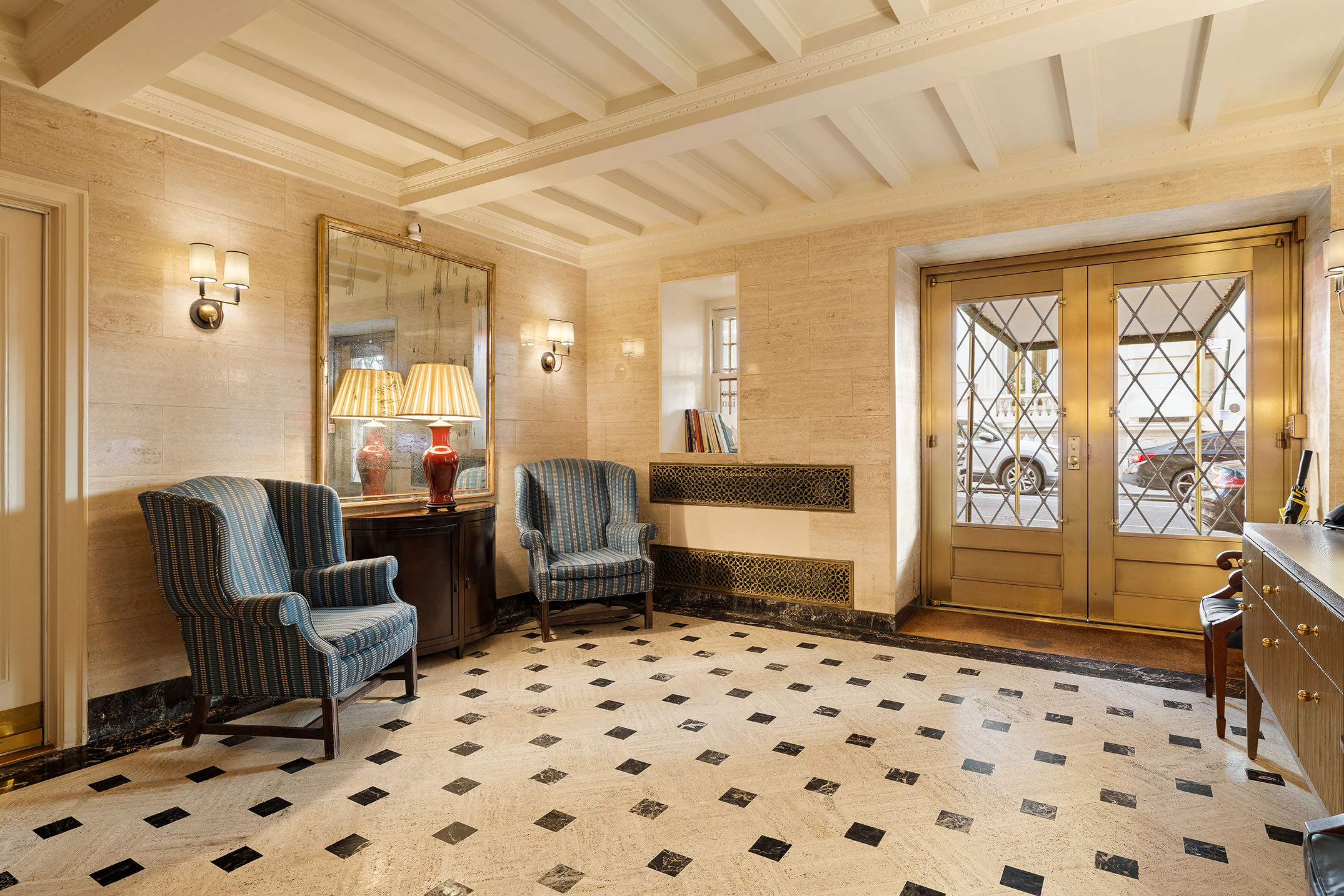 969 5th Avenue, Unit 14 Manhattan, NY 10075 - Photo 15 of 17 a living room with furniture and a large window