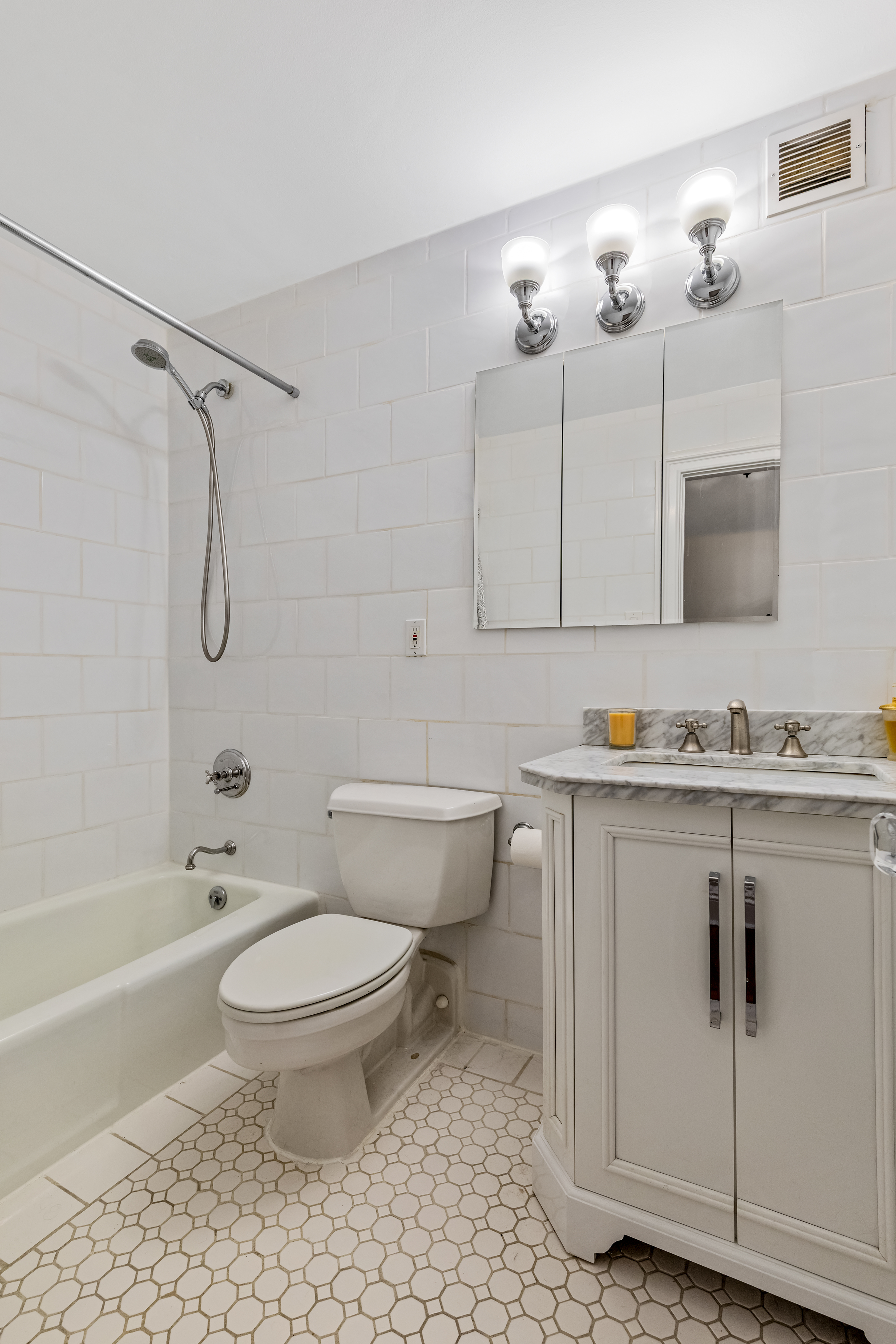 101 West 81st Street, Unit 601 Manhattan, NY 10024 - Photo 8 of 12 a bathroom with a sink toilet a shower and bathtub