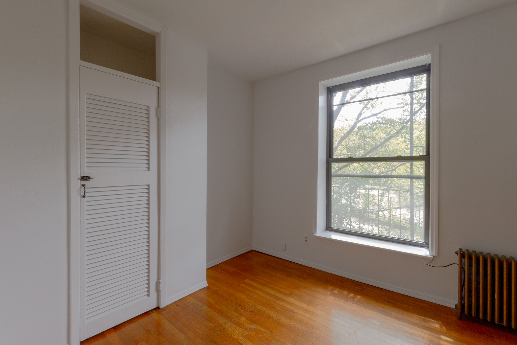312 Prospect Avenue, Unit 2R Brooklyn, NY 11215 - Photo 5 of 10 a view of empty room with window