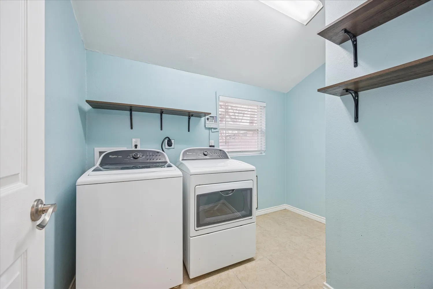a utility room with dryer and washer