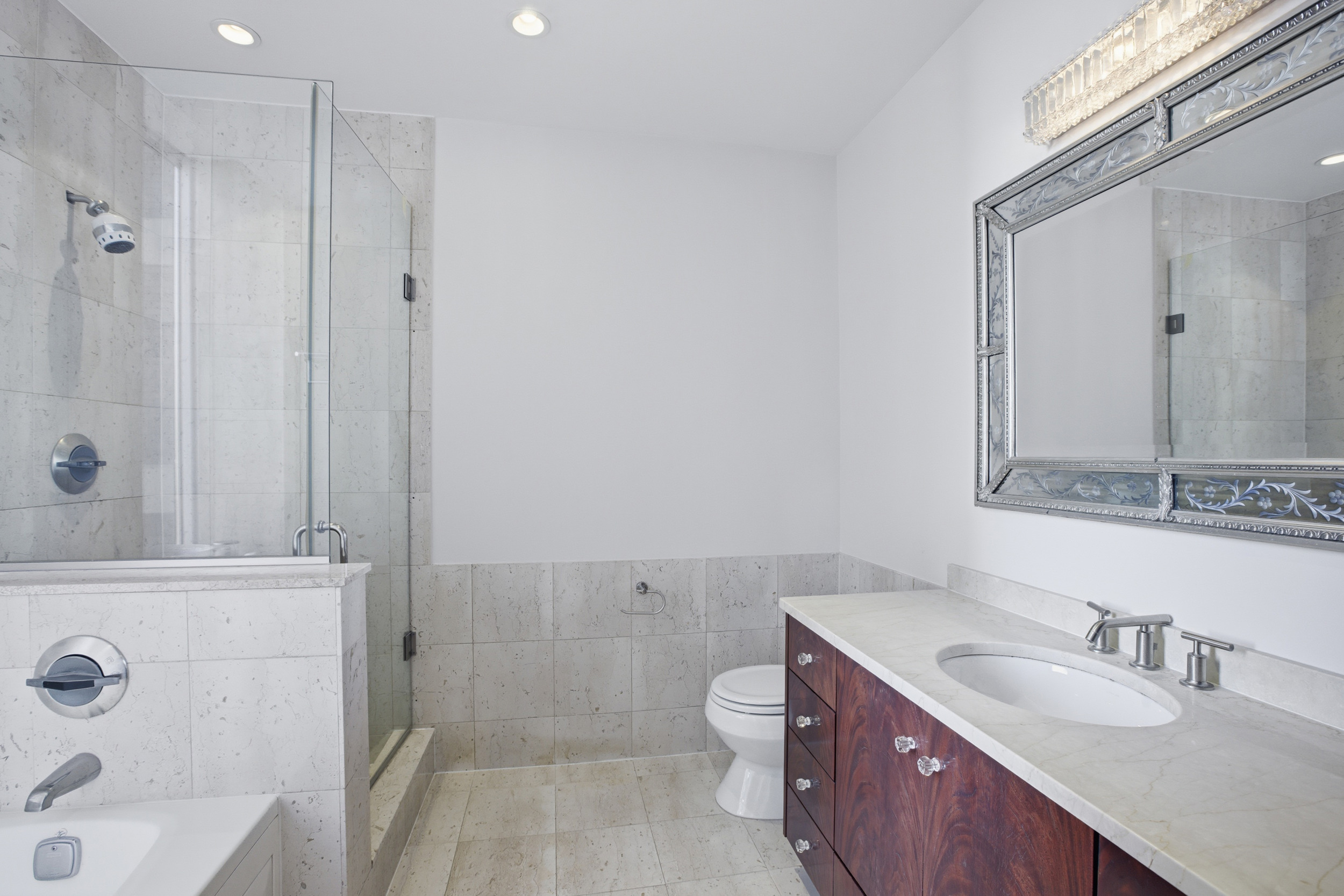 418 East 59th Street, Unit PHA Manhattan, NY 10022 - Photo 15 of 17 a bathroom with a sink a toilet and shower