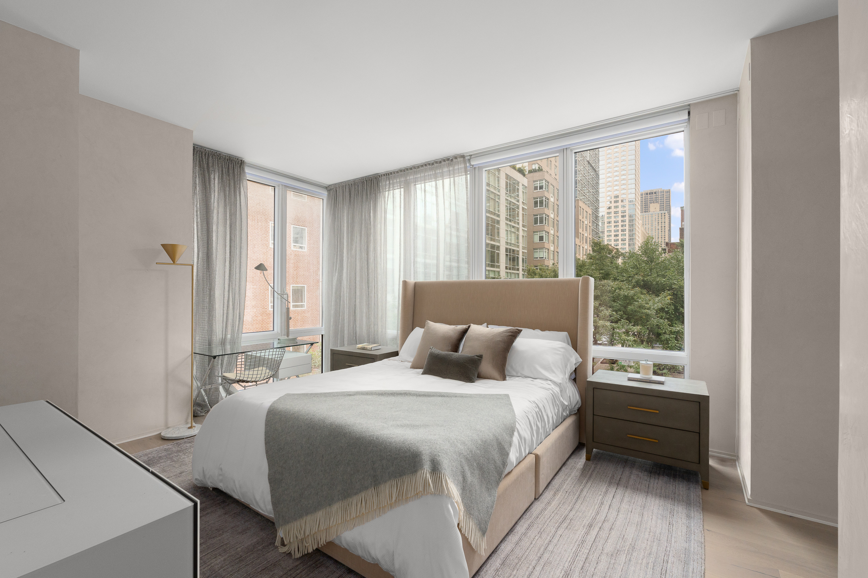 10 West End Avenue, Unit 4B Manhattan, NY 10023 - Photo 6 of 12 a bedroom with a bed and a window