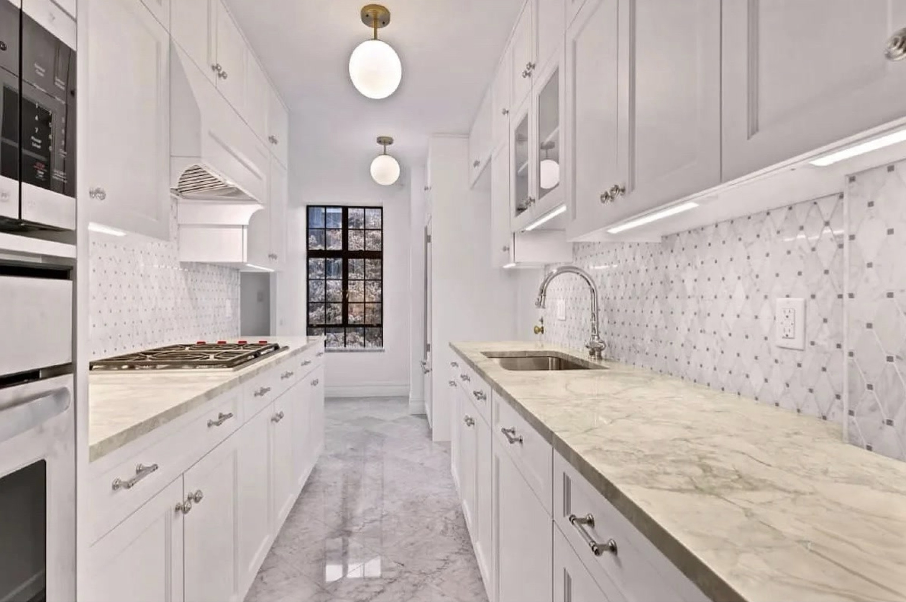 230 East 50th Street, Unit 3B Manhattan, NY 10022 - Photo 14 of 21 a kitchen with granite countertop a sink stove and cabinets