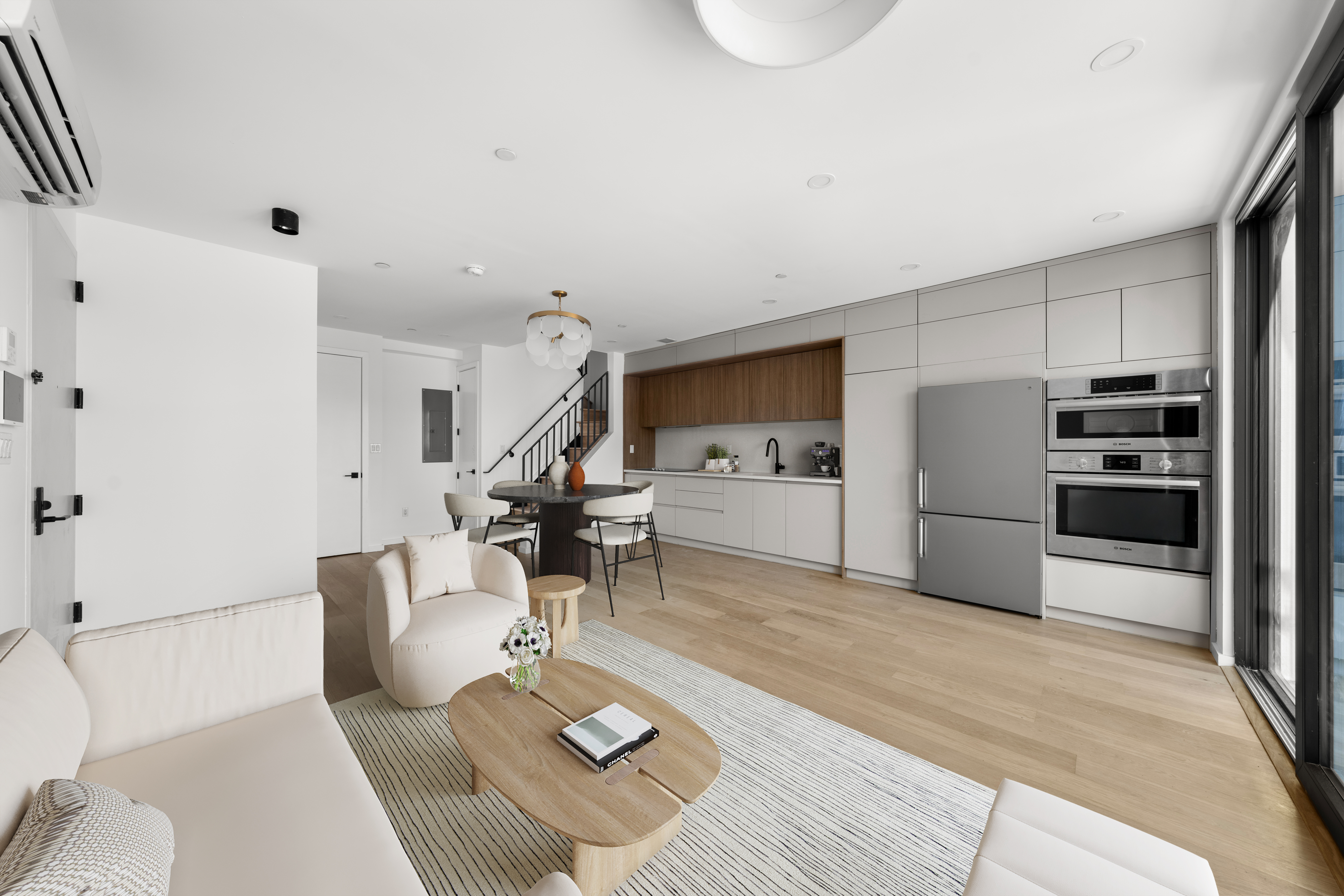 14-35 Broadway, Unit 1A Queens, NY 11106 - Photo 3 of 20 a living room with furniture and kitchen view