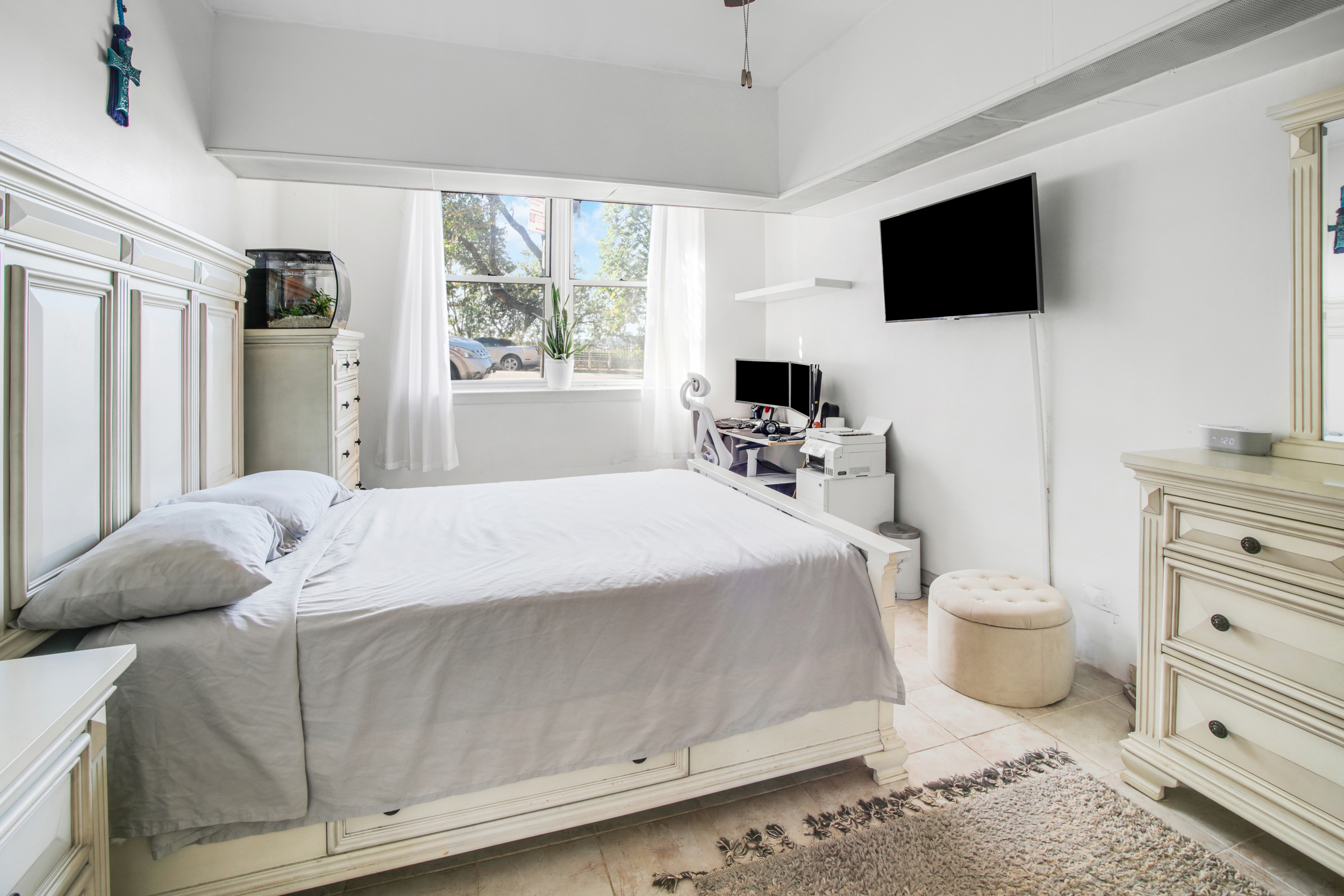 9801 Shore Road, Unit BB Brooklyn, NY 11209 - Photo 8 of 13 a bedroom with a bed and flat tv screen on the dresser