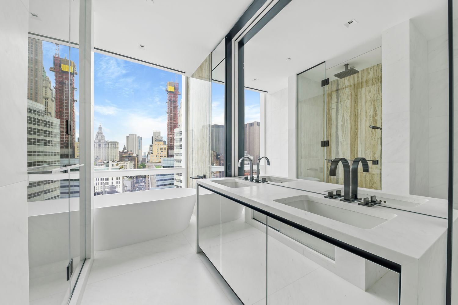 111 Murray Street, Unit 21A Manhattan, NY 10007 - Photo 4 of 14 a bathroom with a double vanity sink and a large mirror