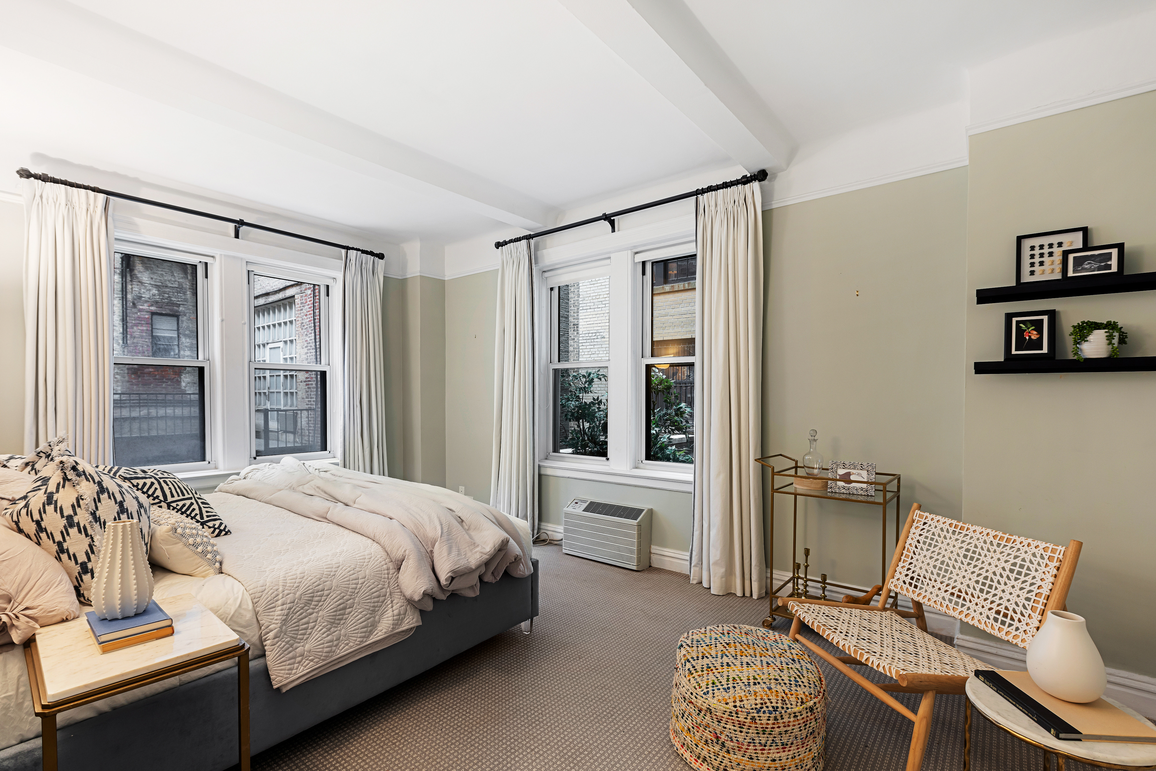25 East 86th Street, Unit 1C Manhattan, NY 10028 - Photo 7 of 18 a bedroom with a bed window and chair
