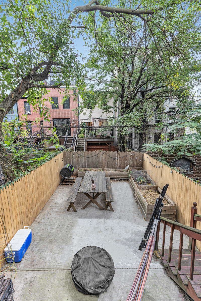 539 Quincy Street Brooklyn, NY 11221 - Photo 11 of 15 a view of a wooden deck and a patio