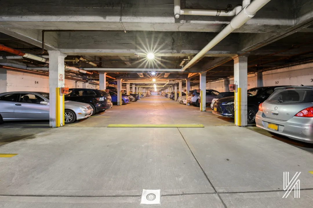a view of parking garage with cars