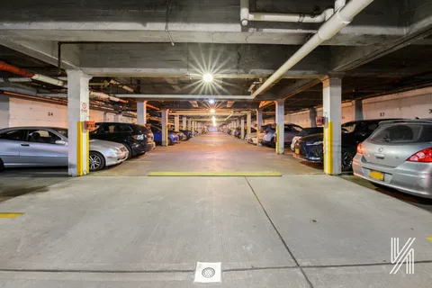 a view of parking garage with cars