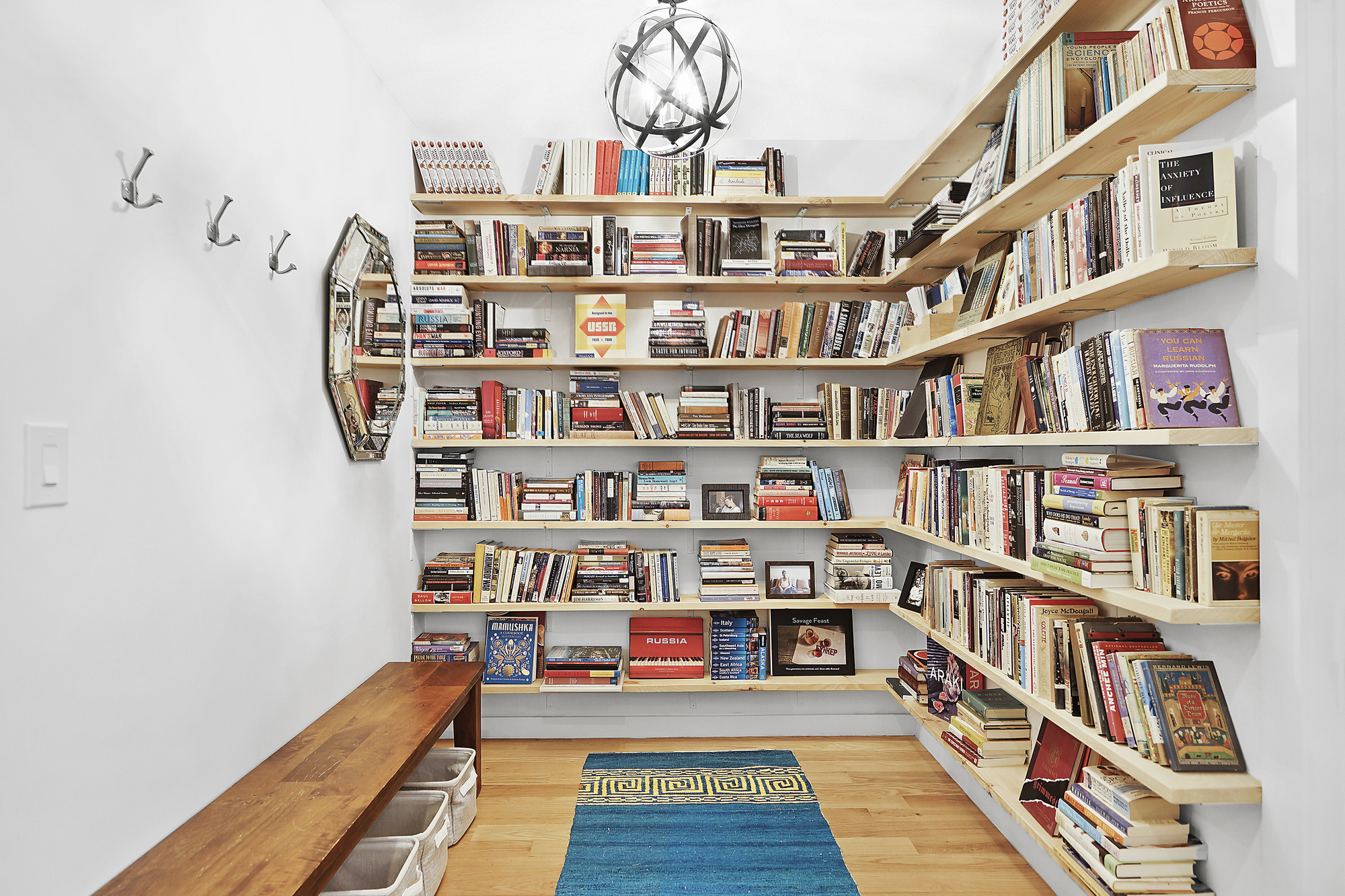 320 Humboldt Street, Unit 2 Brooklyn, NY 11211 - Photo 3 of 10 a book shelf with books and a book shelf