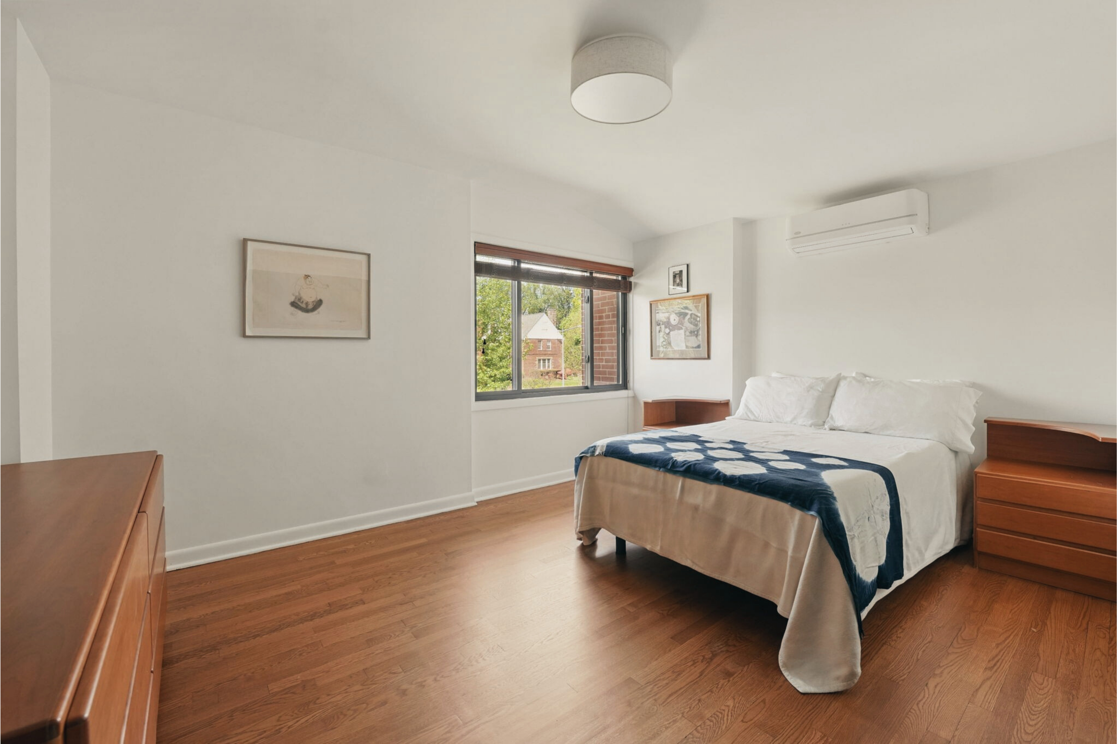 8003 16th Street Northwest Washington, DC 20012 - Photo 28 of 38 a bedroom with a bed and window