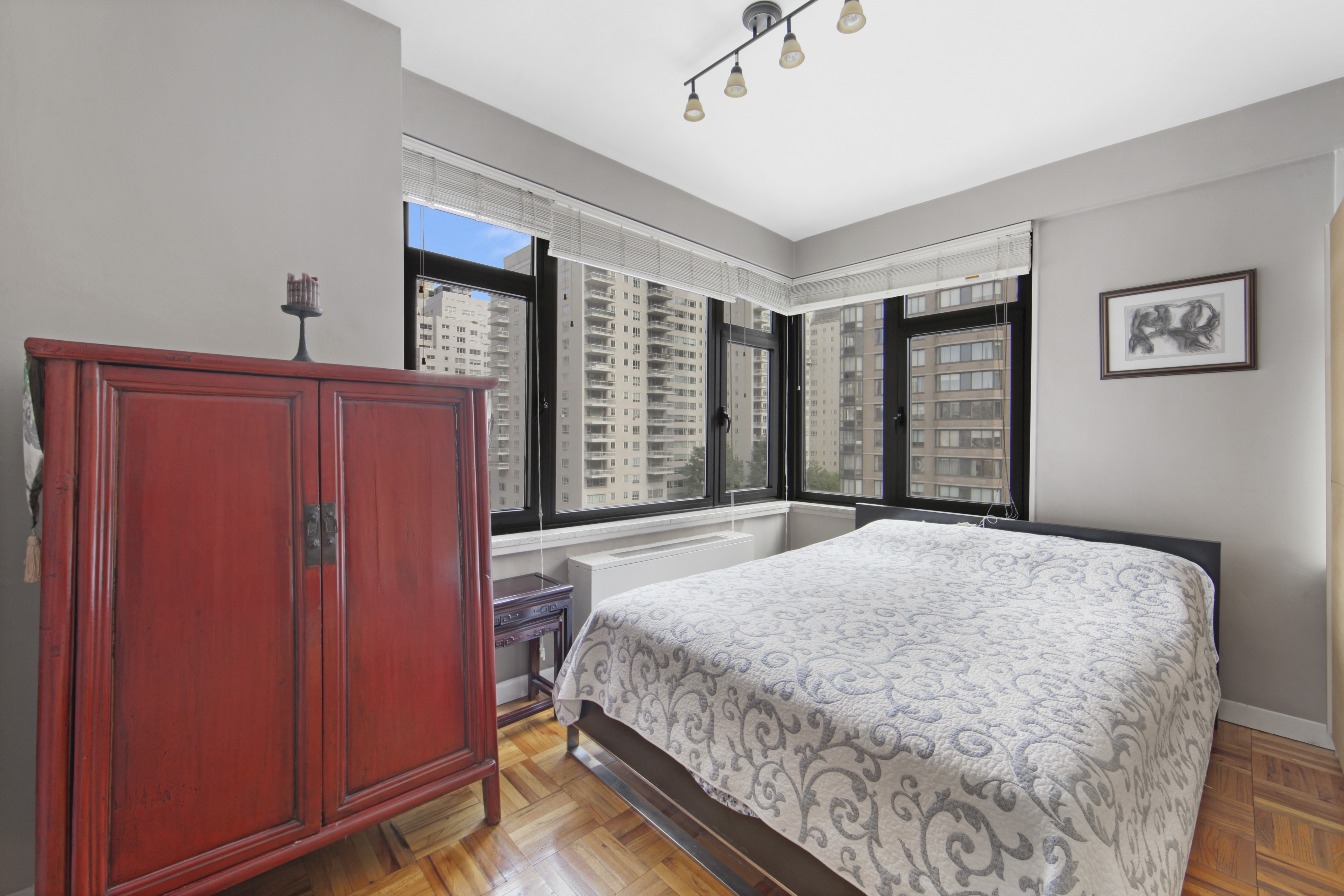 160 East 65th Street, Unit 8A Manhattan, NY 10065 - Photo 5 of 13 a bedroom with a large bed and a window