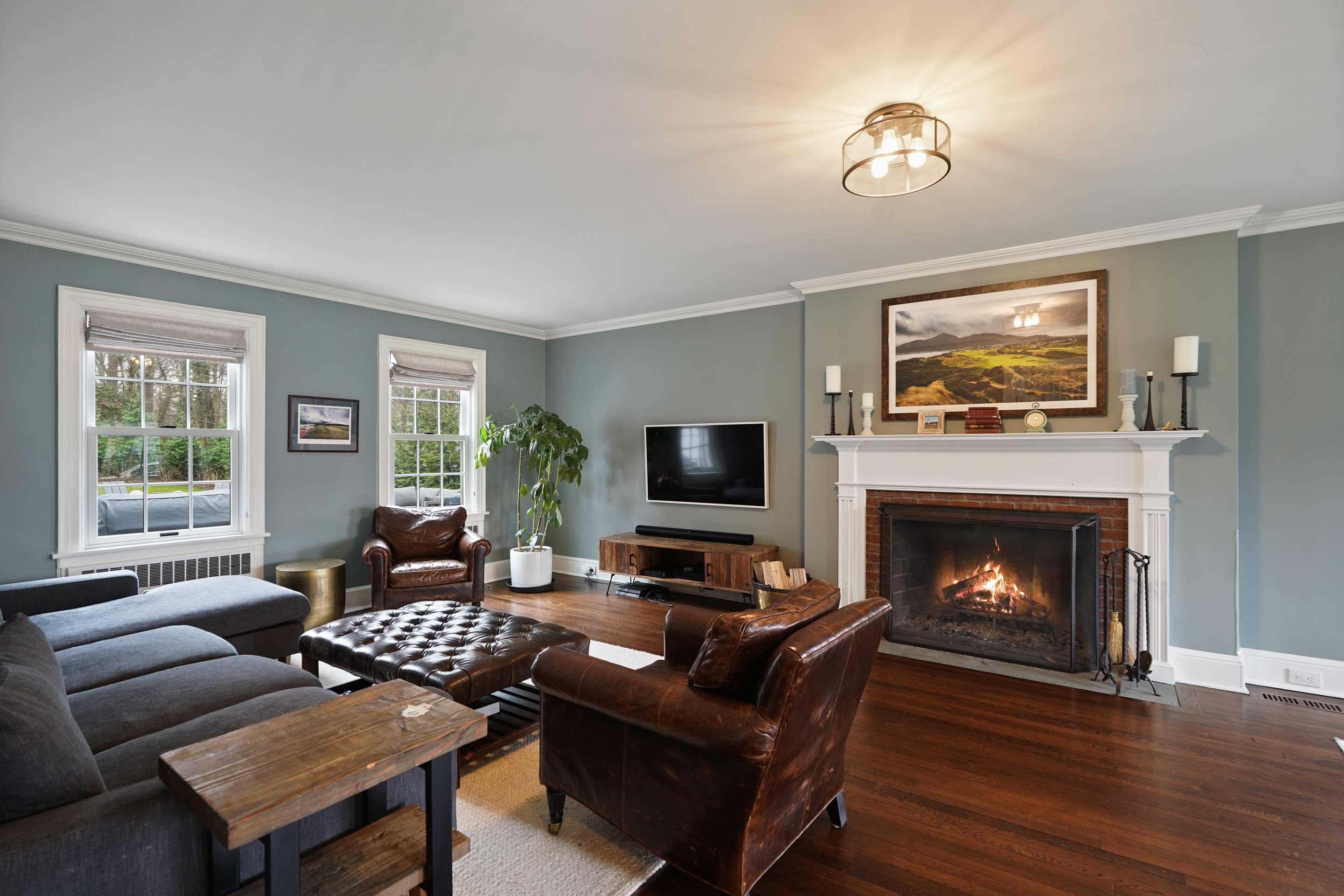 15 Anderson Road Greenwich, CT 06830 - Photo 3 of 30 a living room with furniture a fireplace and a flat screen tv