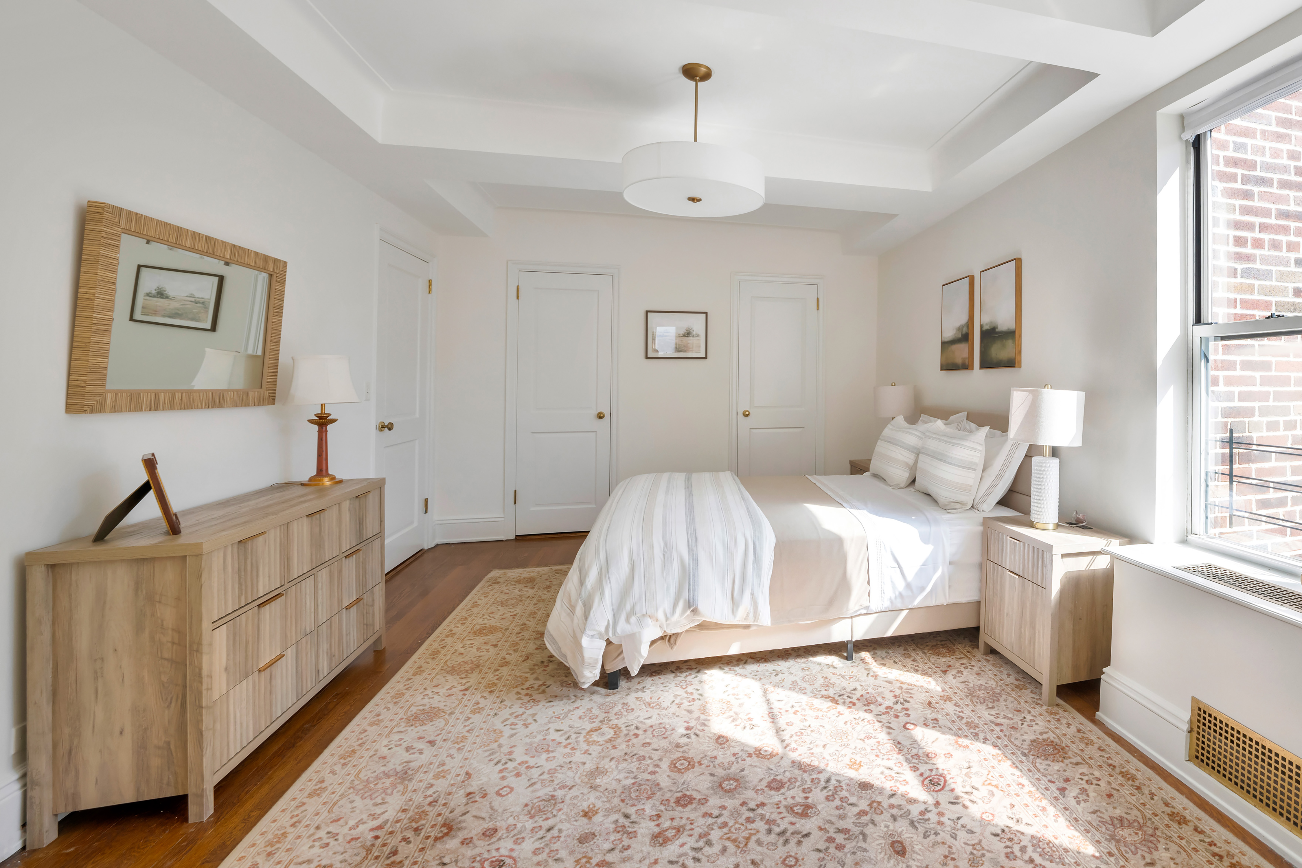 47 East 88th Street, Unit 15A Manhattan, NY 10128 - Photo 13 of 21 a spacious bedroom with a bed and a window
