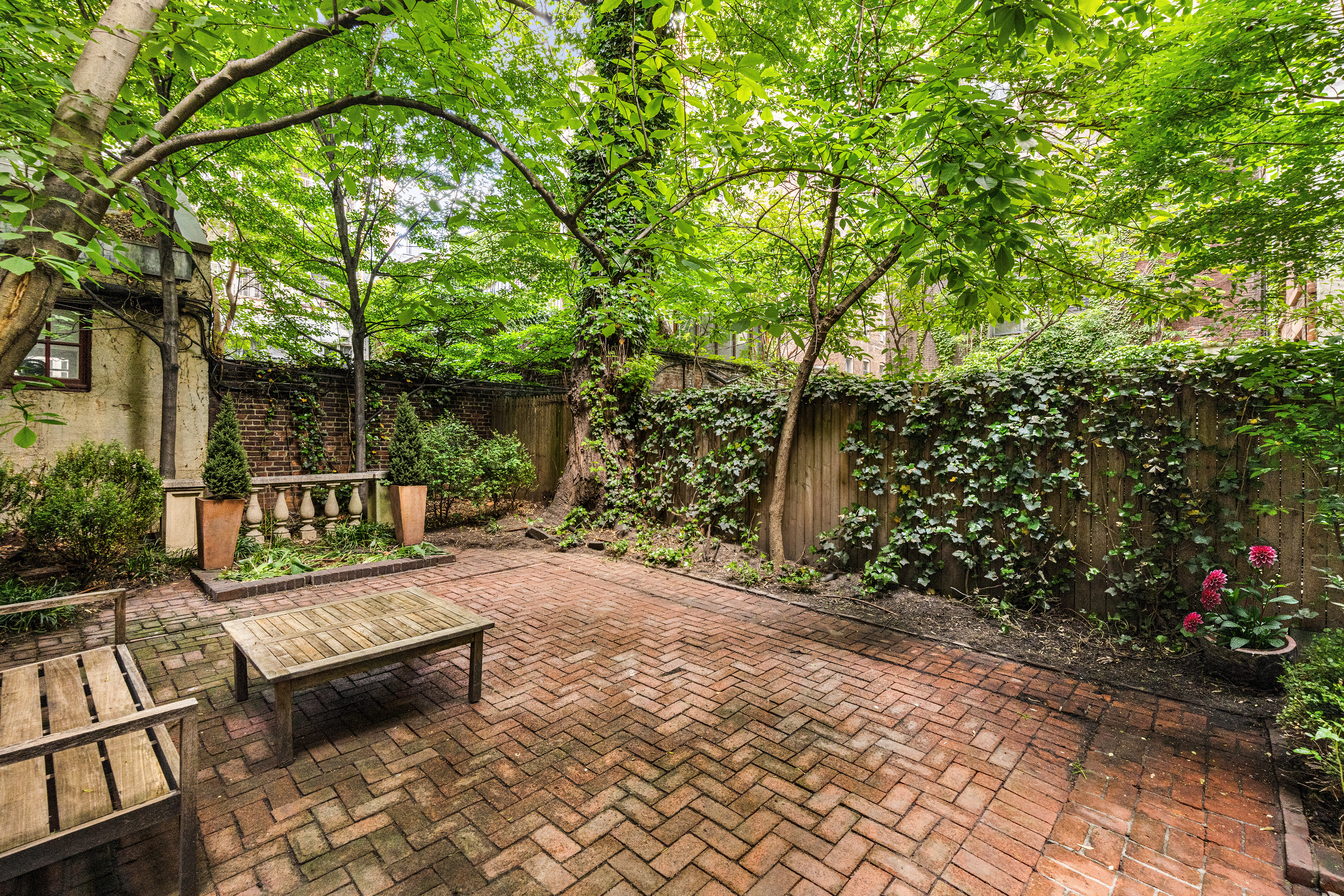 57 West 9th Street Manhattan, NY 10011 - Photo 6 of 11 a view of a bench sitting in backyard