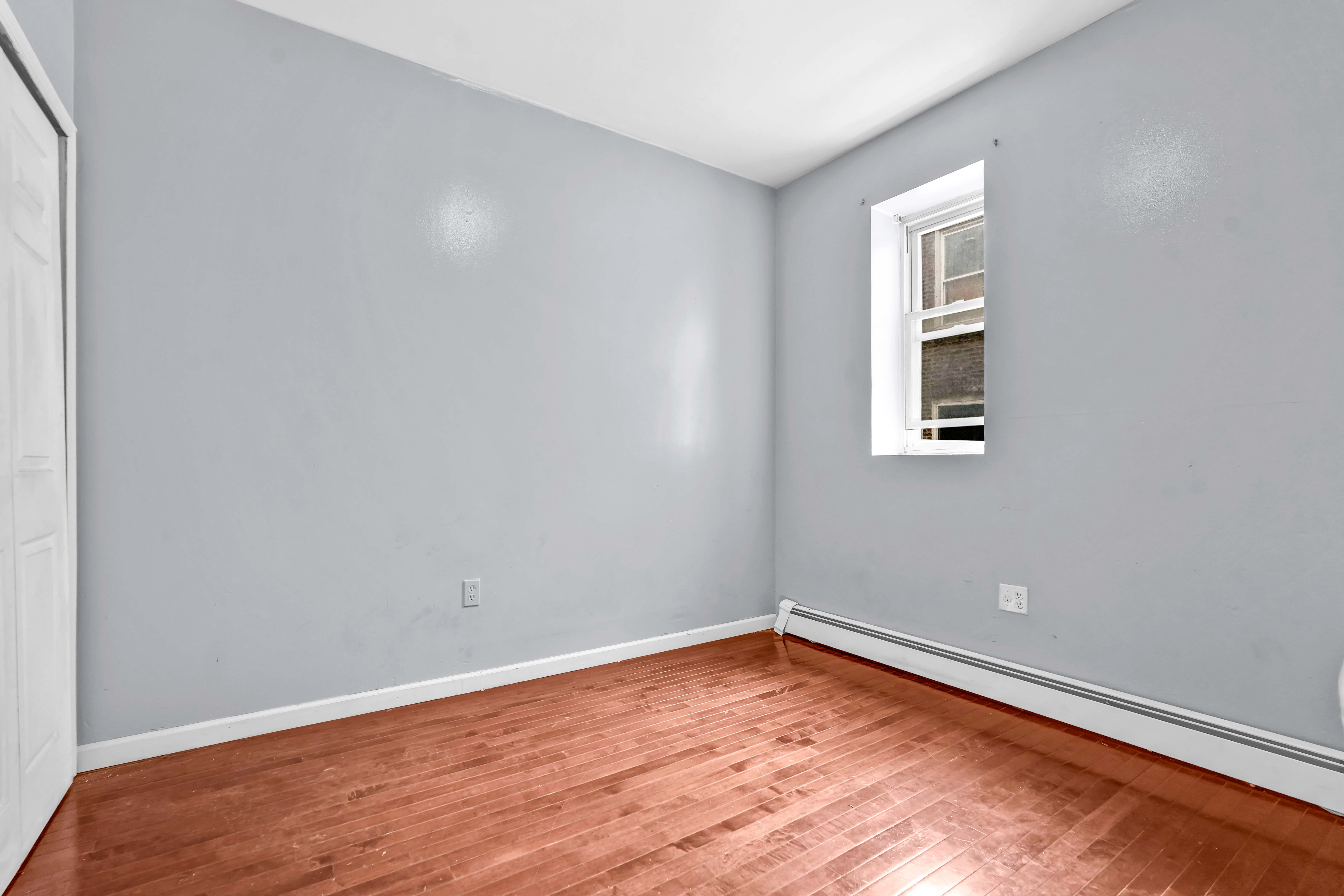 1633 St Johns Place, Unit 3 Brooklyn, NY 11233 - Photo 15 of 29 an empty room with a window