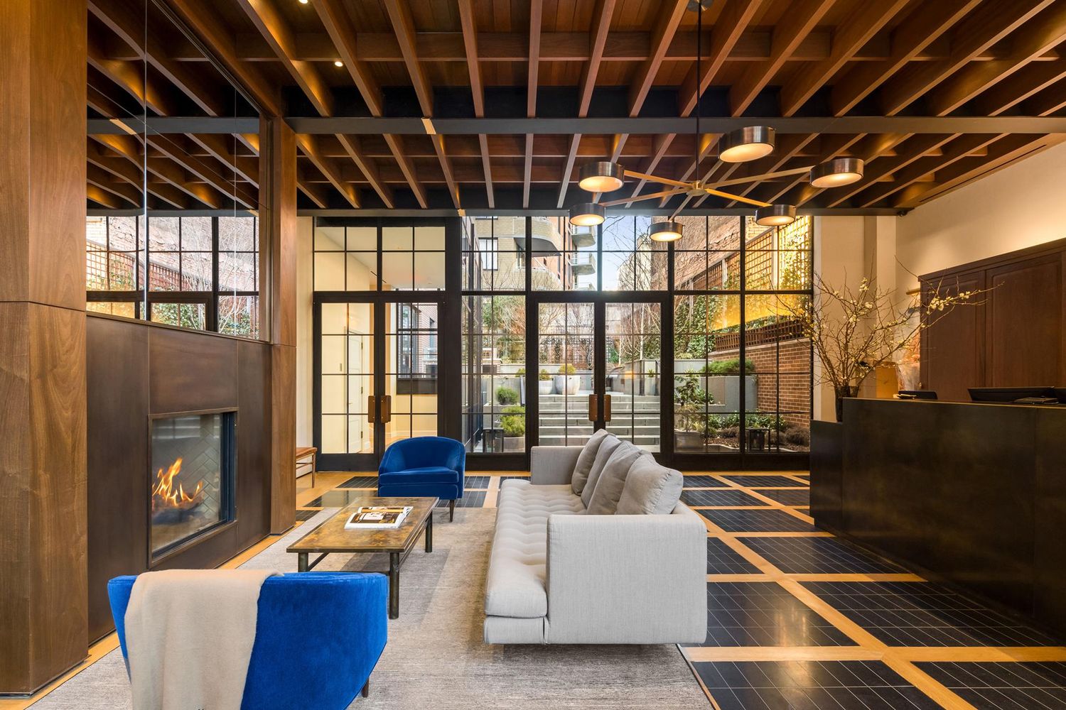 275 West 10th Street, Unit 3B Manhattan, NY 10014 - Photo 18 of 20 a living room with furniture a fireplace and a flat screen tv