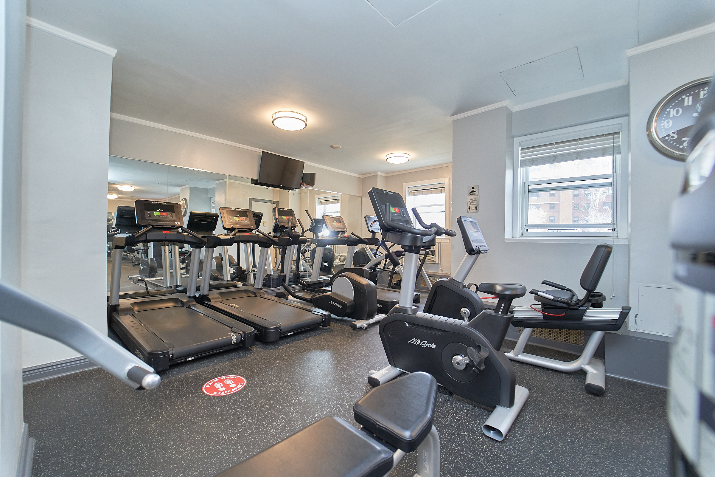 122 Ashland Place, Unit 15F Brooklyn, NY 11201 - Photo 7 of 13 a room with gym equipment and windows